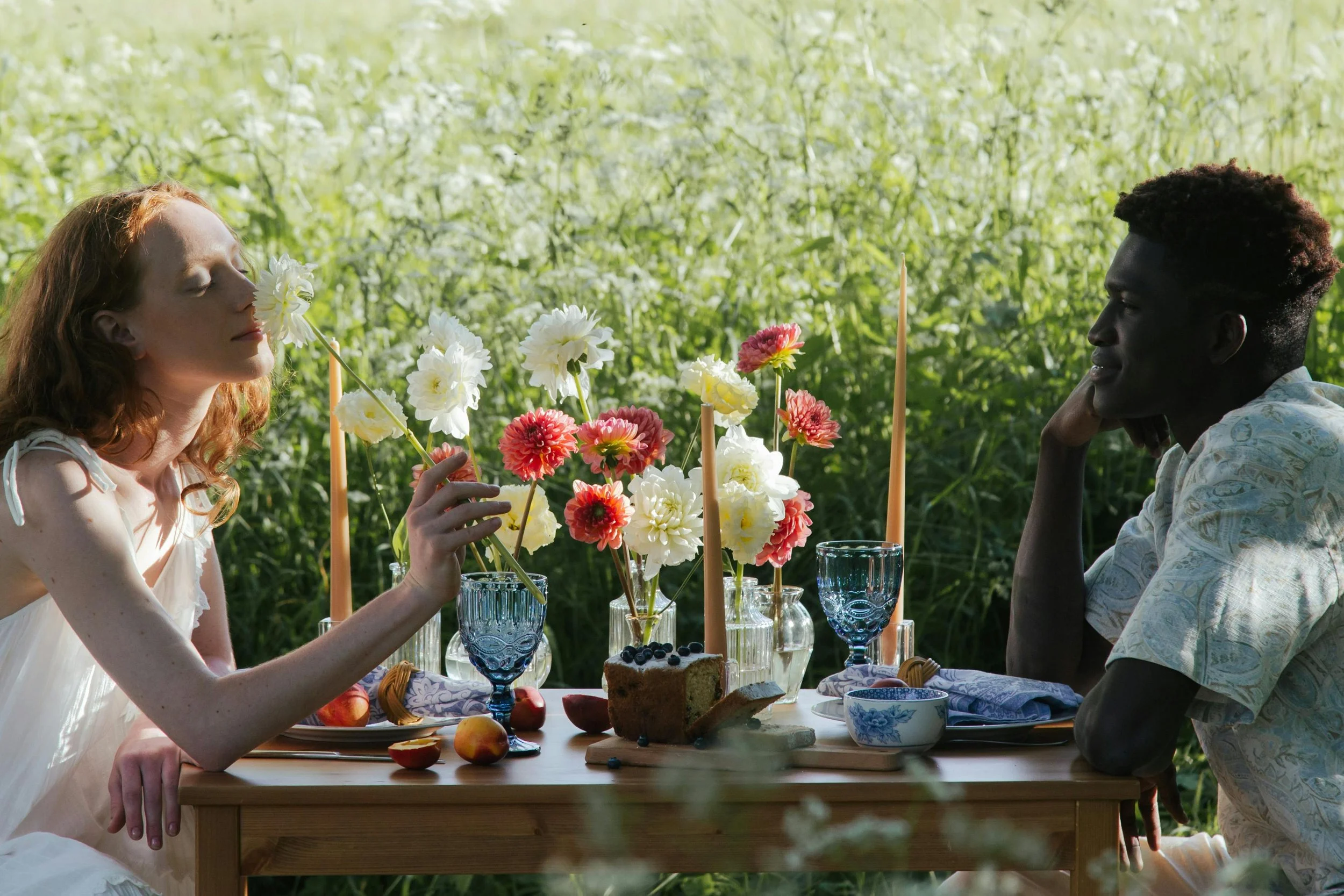 couple sitting at a table outside