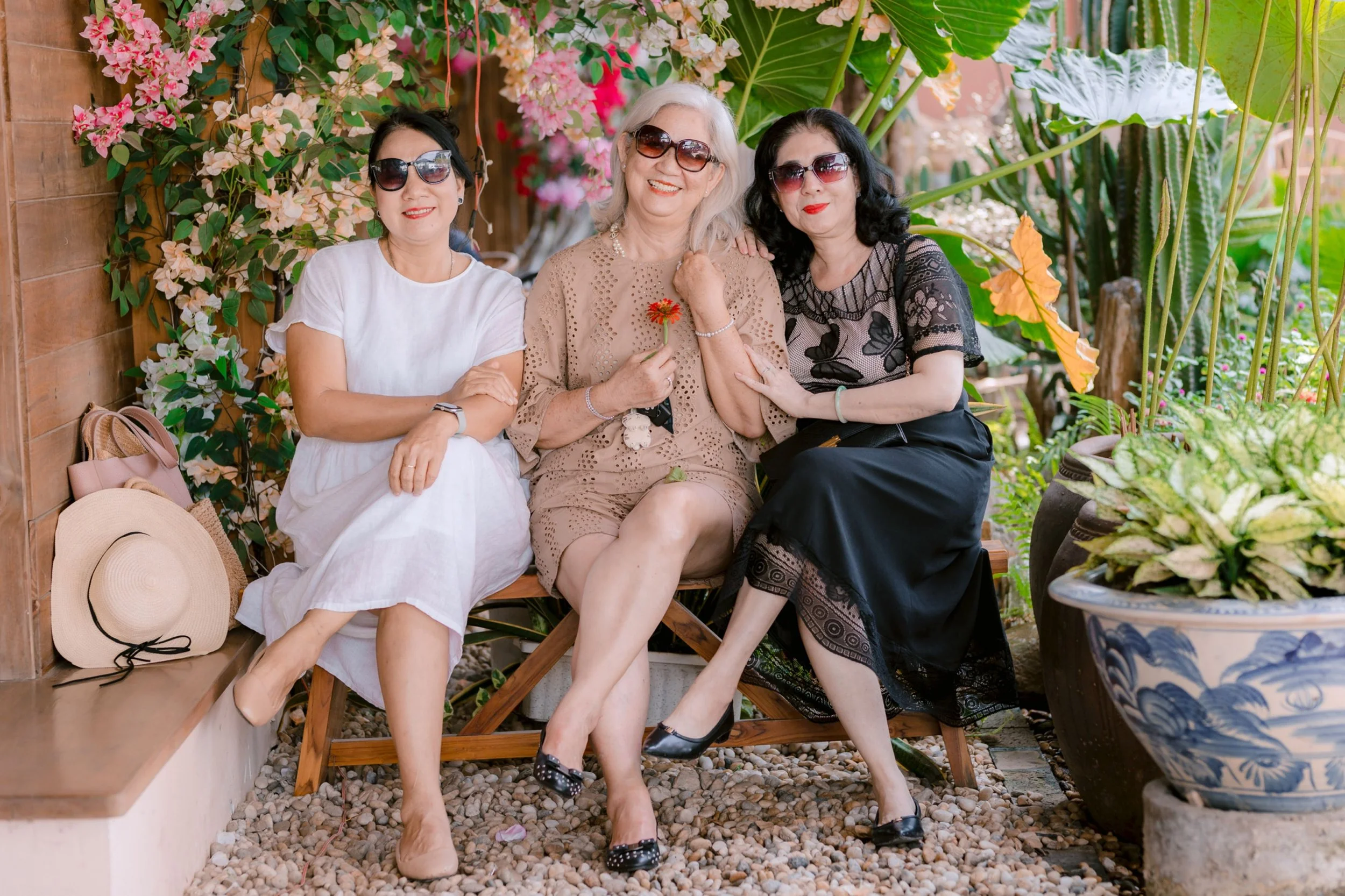 A close-knit, group of supportive female friends laughing together outdoors, celebrating modern sisterhood.