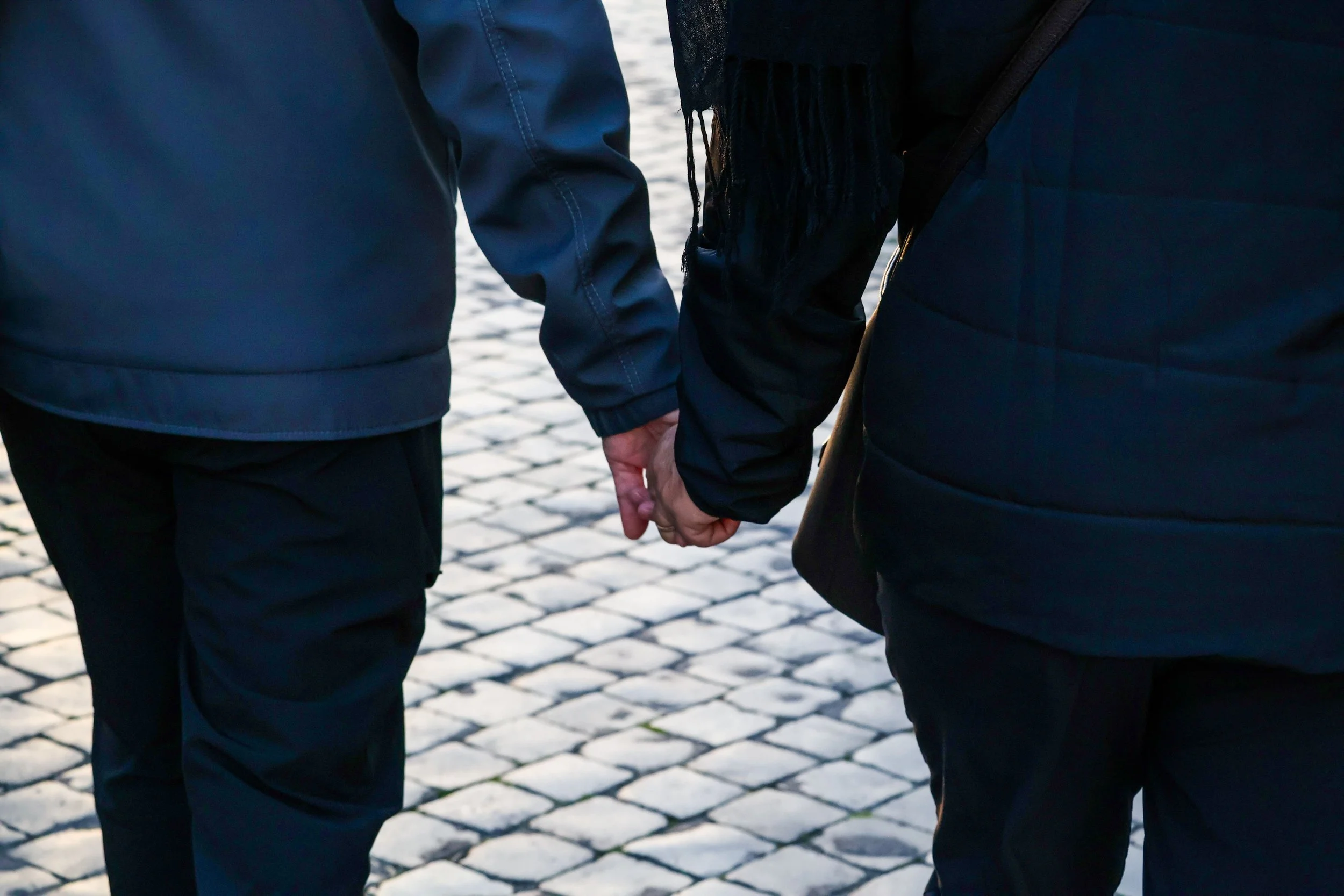 A happy couple holding hands, embodying the joy of a peaceful slow burn relationship.