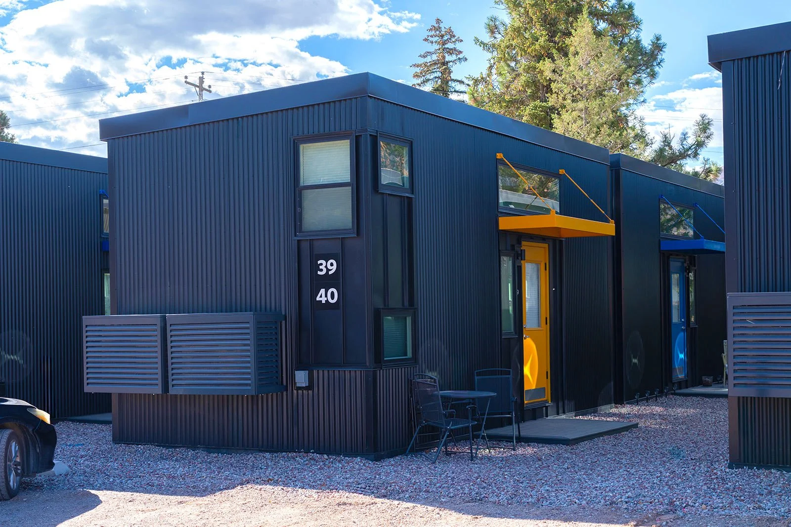 Tiny Town units 39 and 40 with yellow and blue accent doors and awnings

Units 39 and 40 at Tiny Town use color-coded doors and awnings, yellow and blue, to help residents and guests find their home quickly.