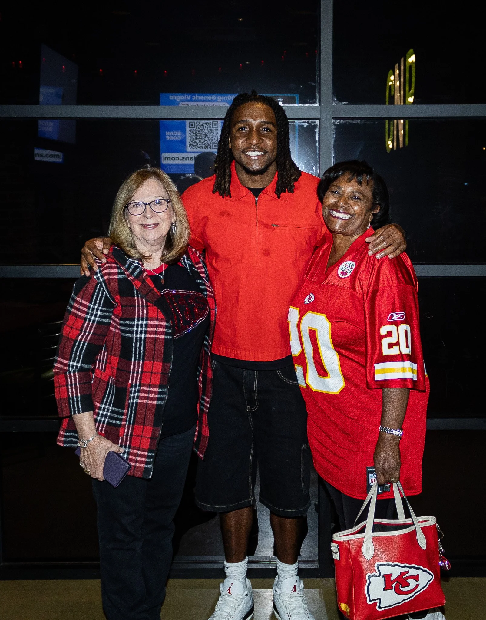 Attendees pose with Nohl Williams after the live Kansas City Huddle episode.