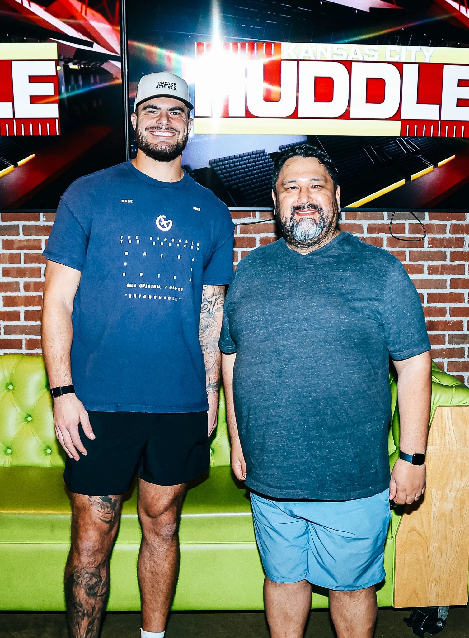 Jared Wiley poses with a fan during the meet & greet for Kansas City Huddle