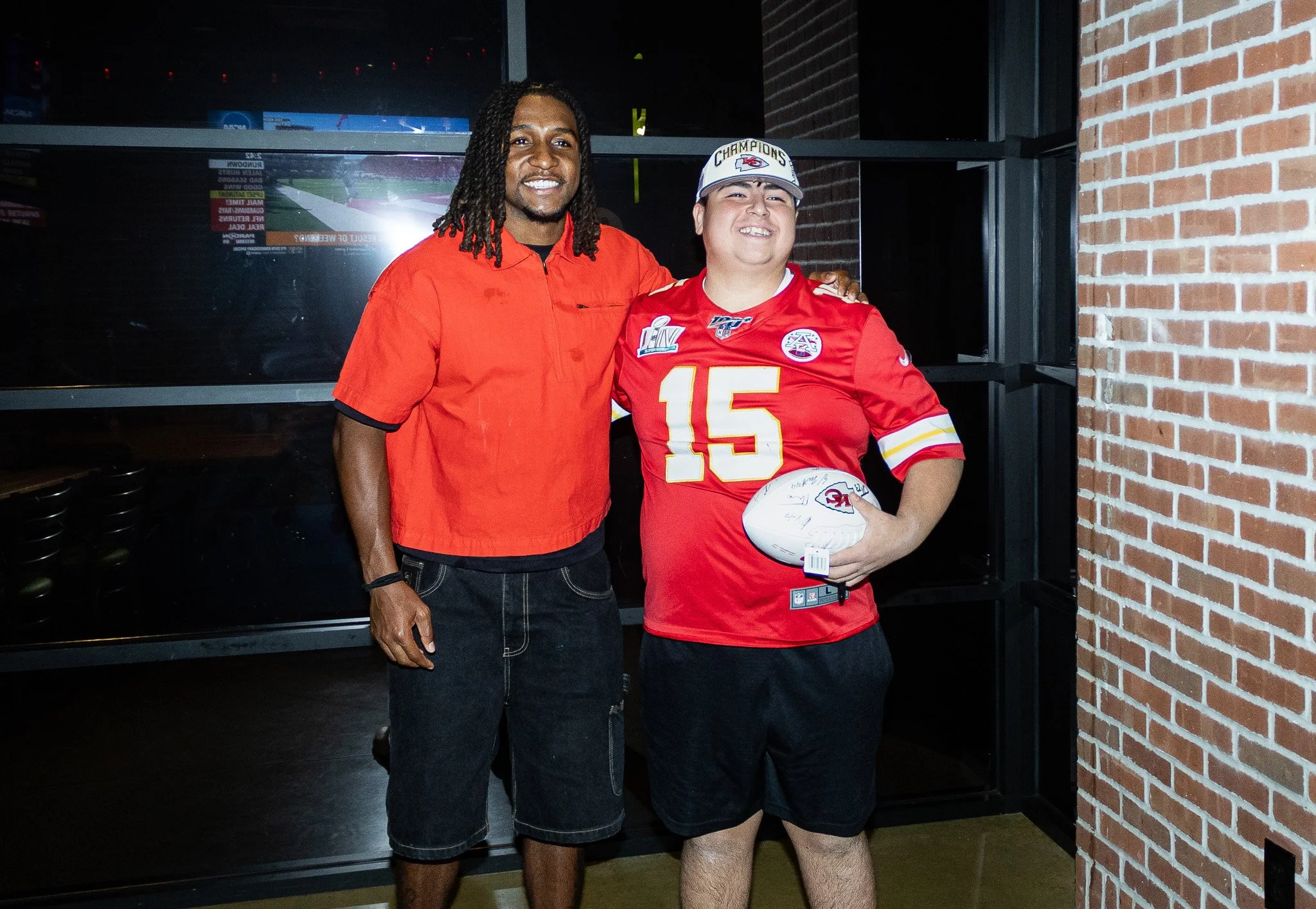 Nohl Williams poses with a fan after the live episode of Kansas City Huddle 