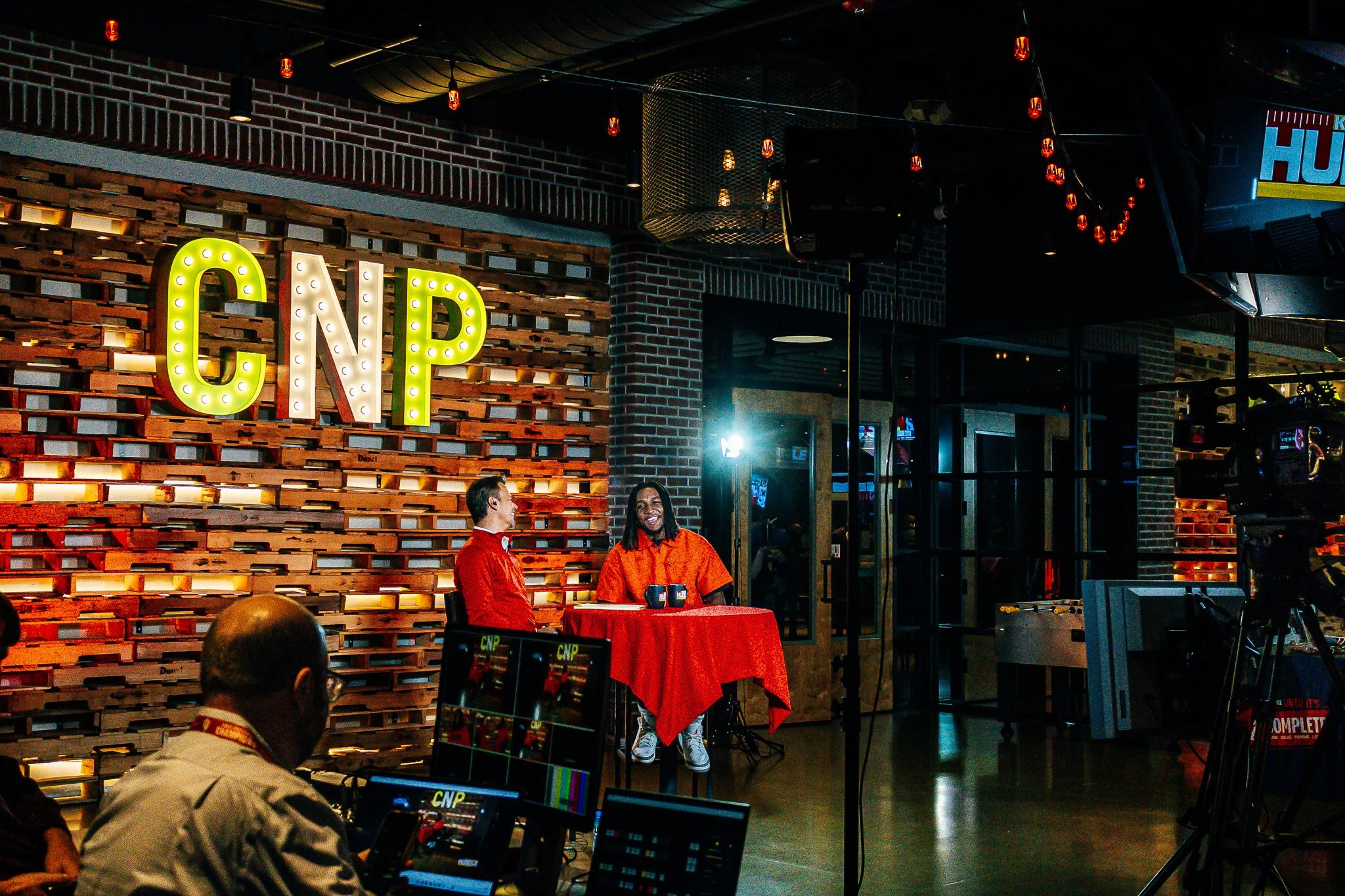 The whole stage setup at the live episode taping of Kansas City Huddle at Chicken N Pickle Overland Park