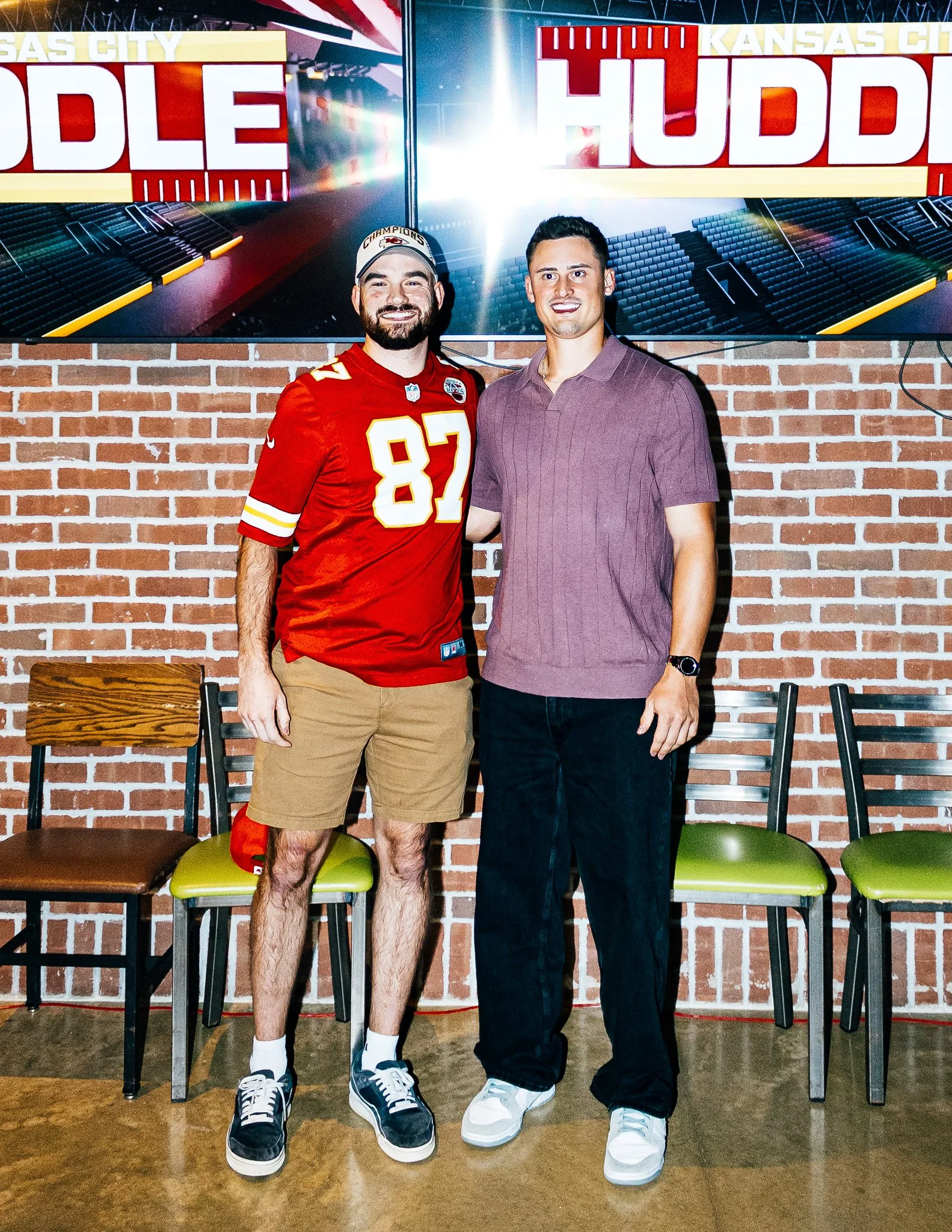Matt Araiza posing for a picture with a fan during Kansas City Huddle at Chicken N Pickle Overland Park
