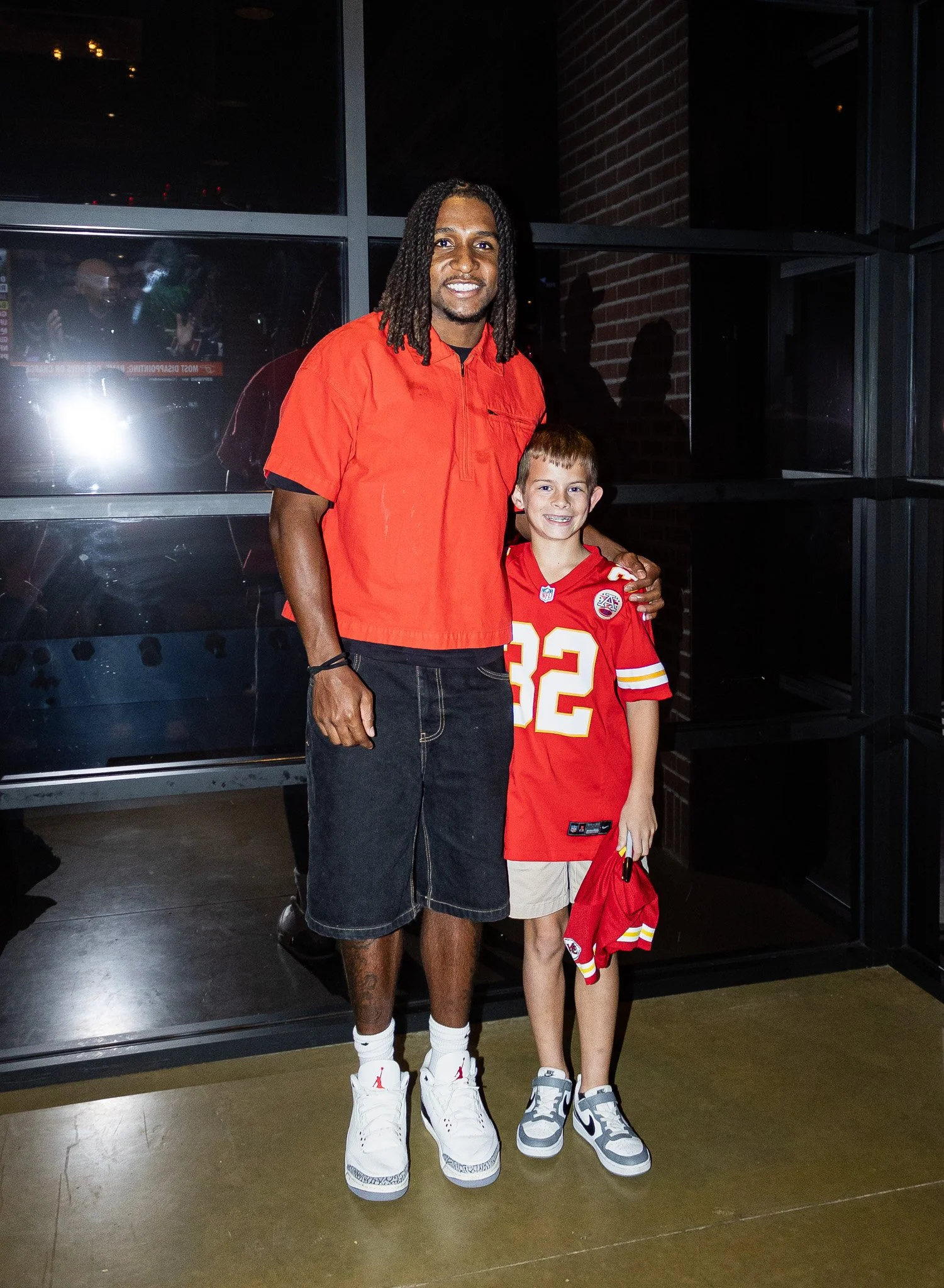 A fan meets Nohl Williams after his appearance as co-host of Kansas City Huddle.