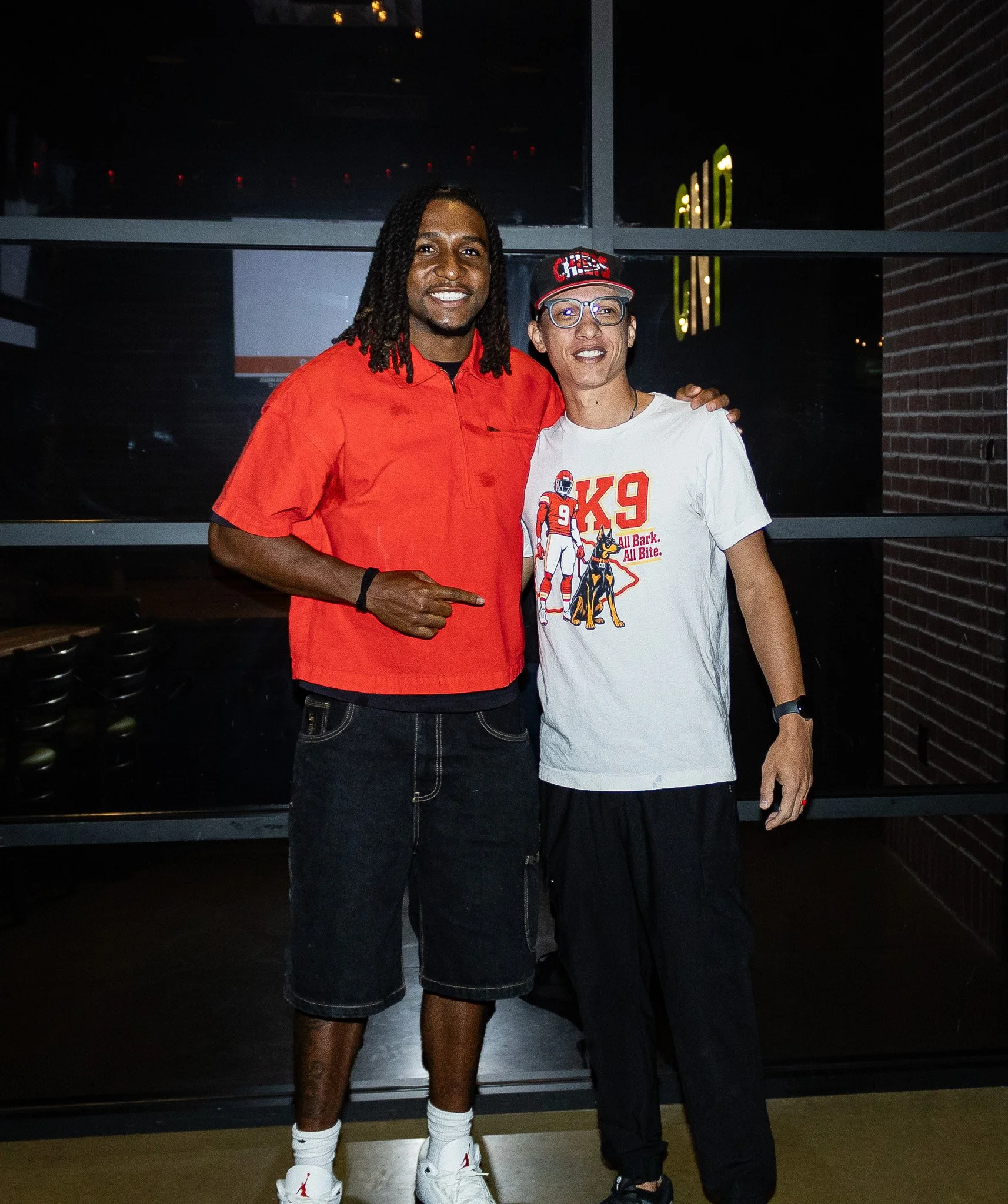 Nohl Williams takes a picture with a fan after Kansas City Huddle live show