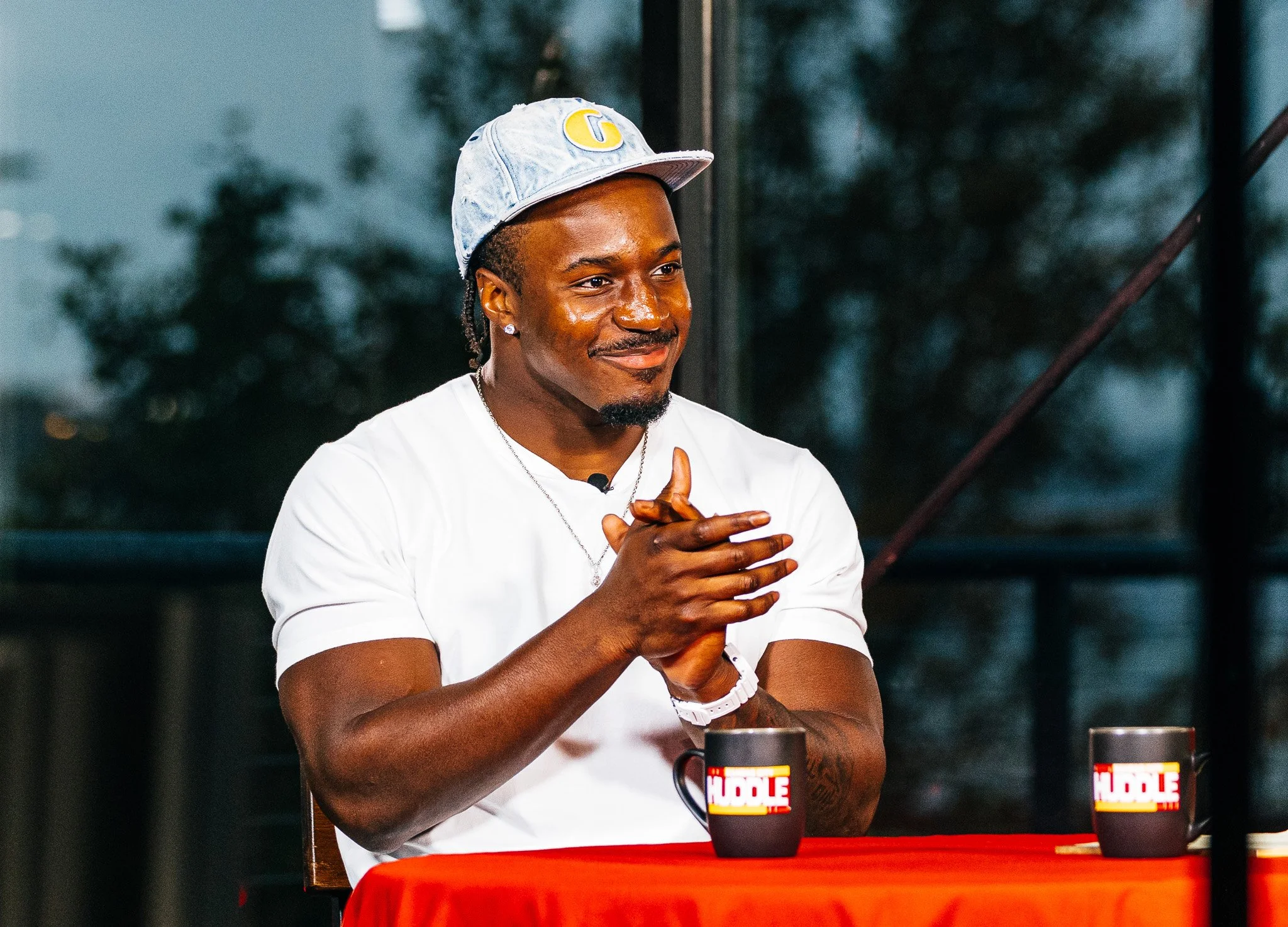 Jeffrey Bassa speaking during the Kansas City Huddle live taping at Chicken N Pickle