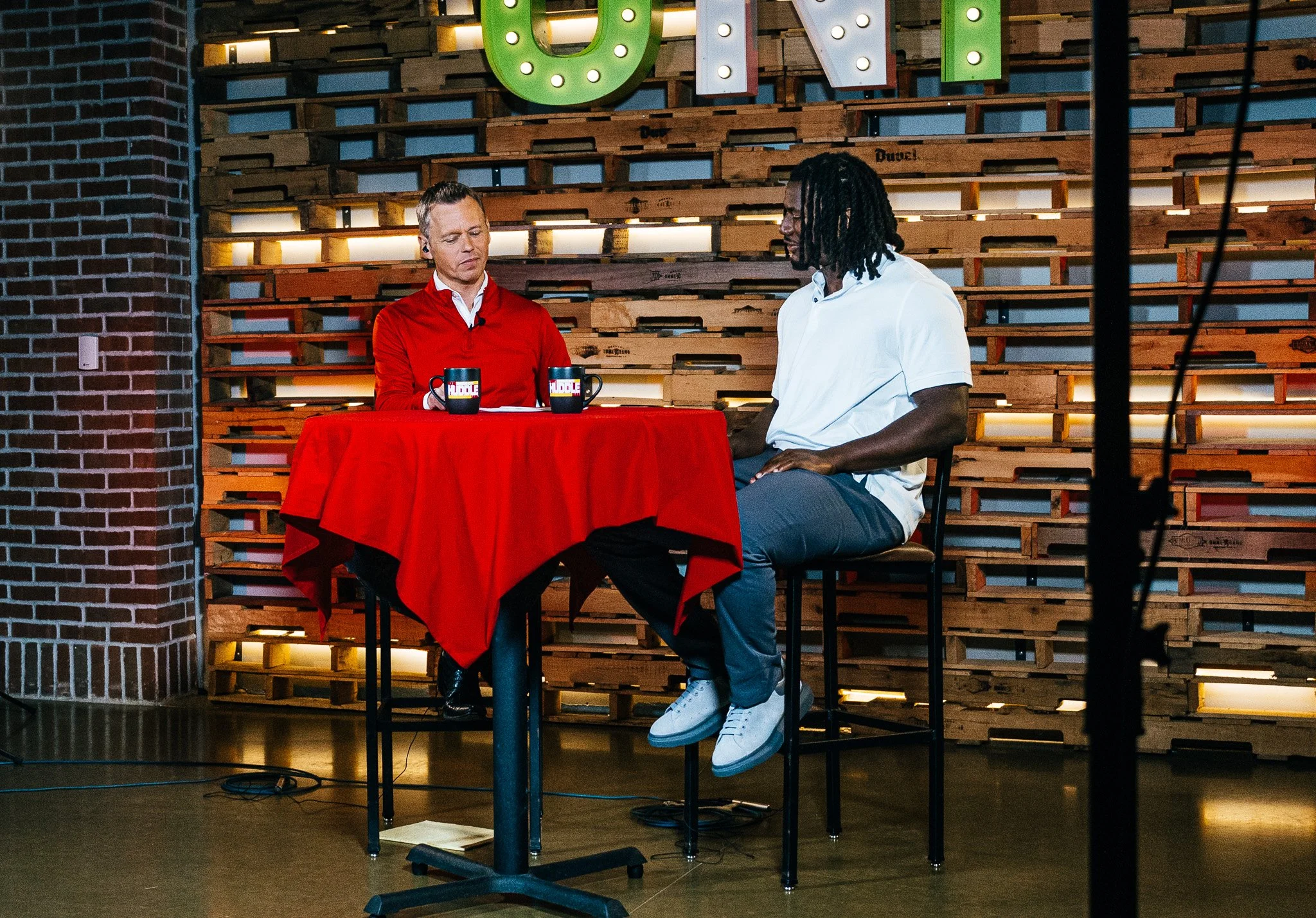 R Mason Thomas talking with host Rob Collins during Kansas City Huddle