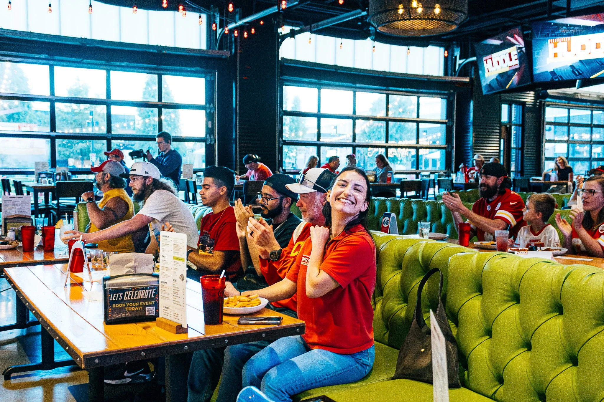 Fans watching the Kansas City Huddle live taping at Chicken N Pickle in Overland Park