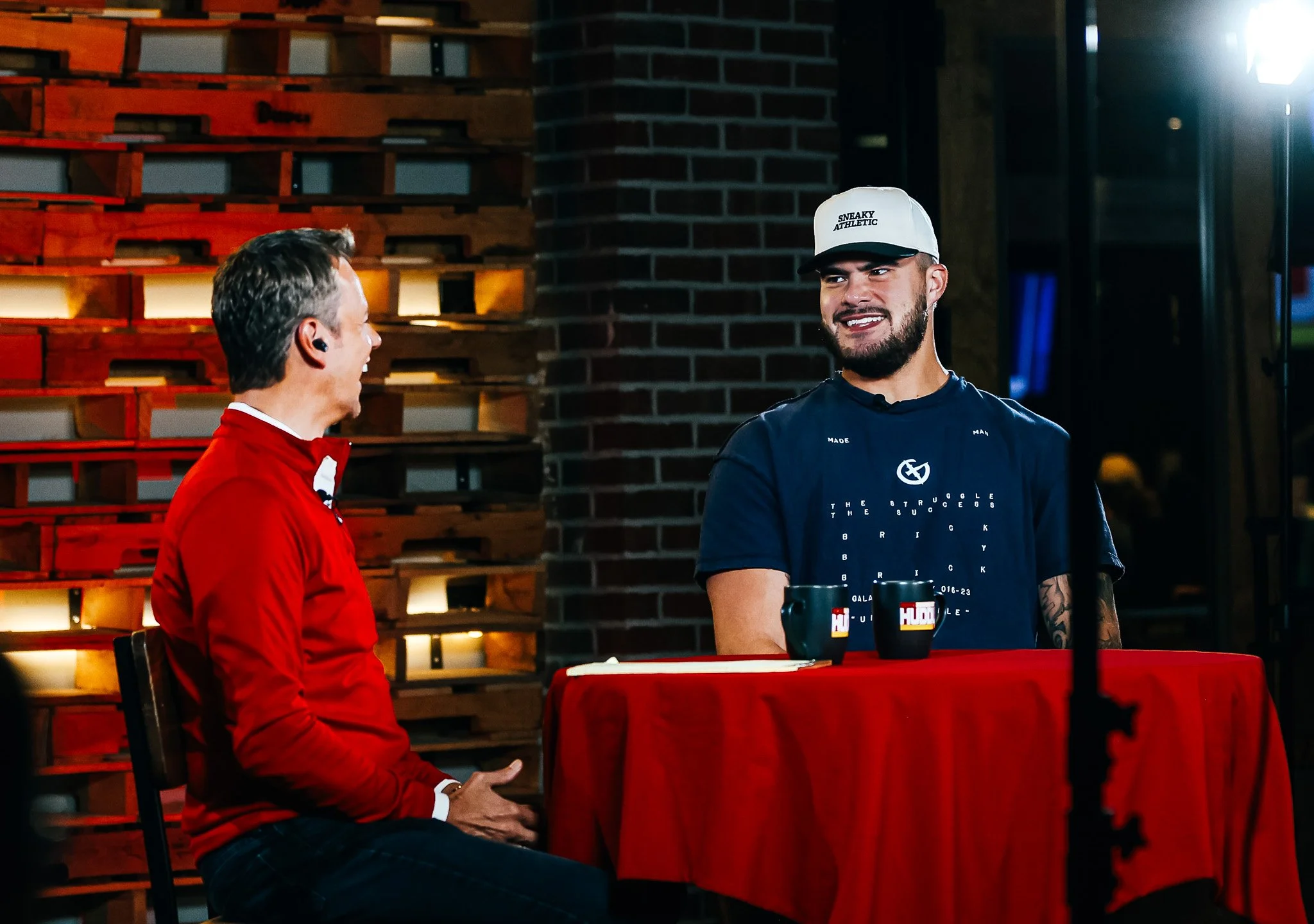 Rob Collins and Jared Wiley on stage during the Kansas City Huddle live show.
