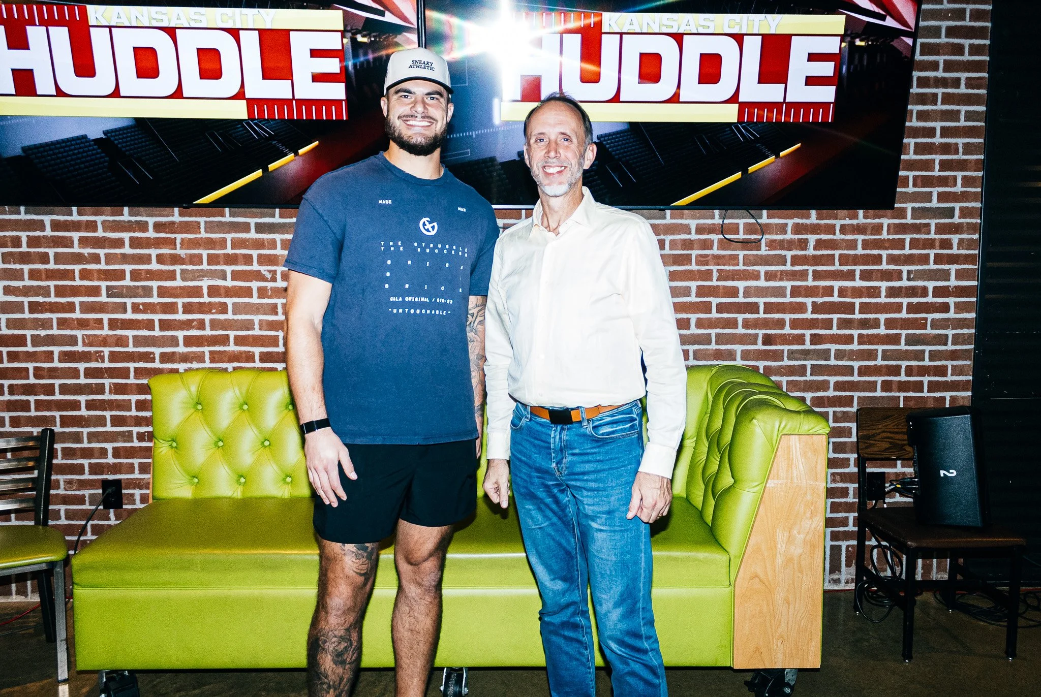 Jared Wiley poses with a fan during the meet & greet for Kansas City Huddle