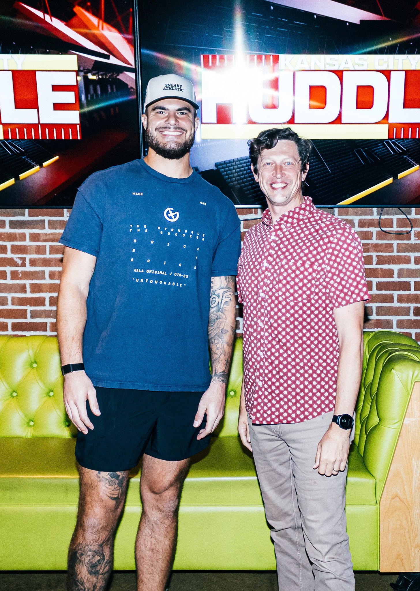 Jared Wiley poses with a fan during the meet & greet for Kansas City Huddle