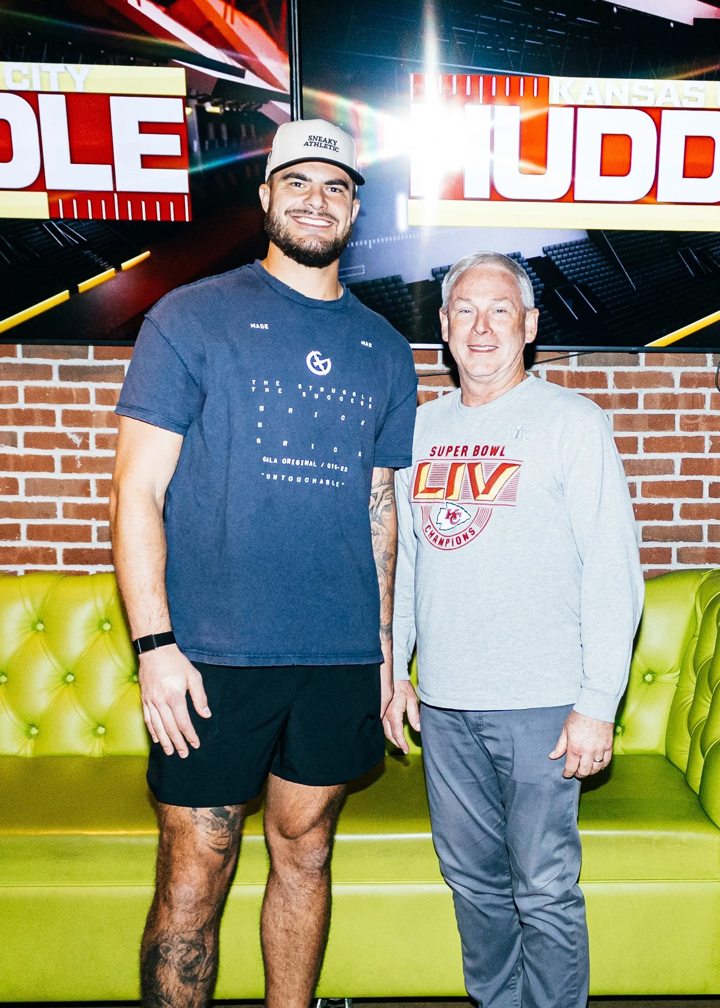 Jared Wiley poses with a fan during the meet & greet for Kansas City Huddle