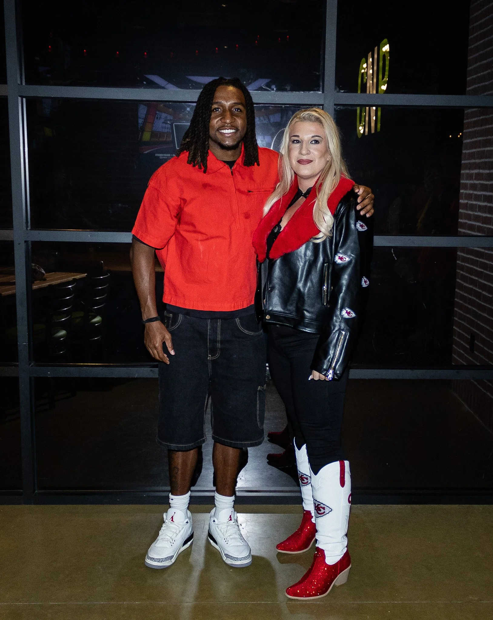 A fan poses with Nohl Williams during the Kansas City Huddle post-show meet and greet.