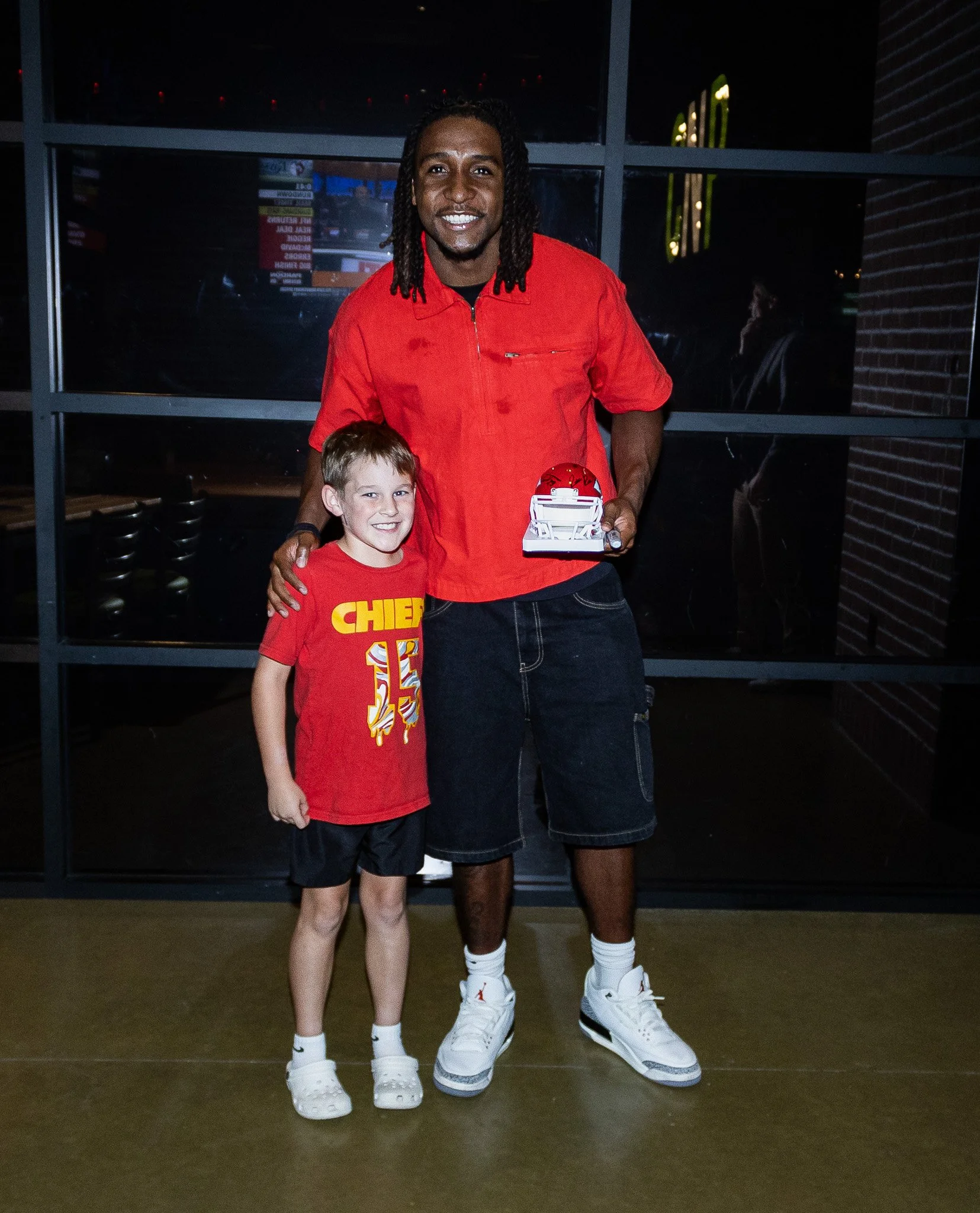 Nohl Williams poses with a fan after Kansas City Huddle at Chicken N Pickle
