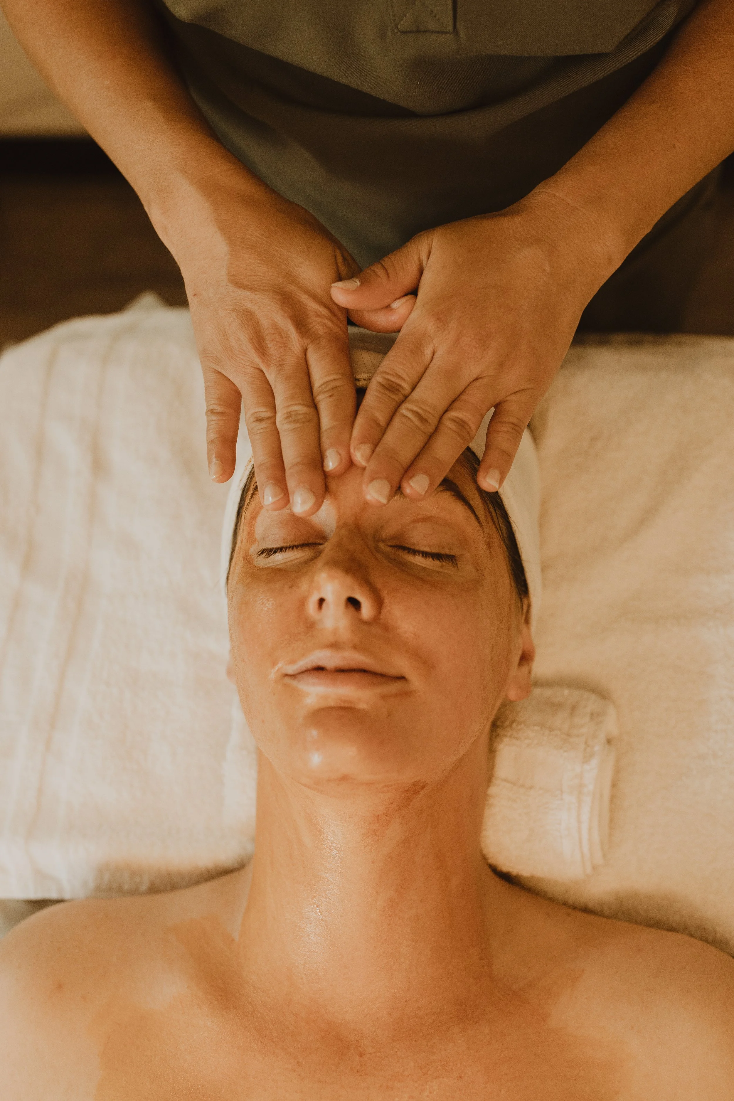 client receiving a facial massage, holistic skincare in Arroyo Grande, California