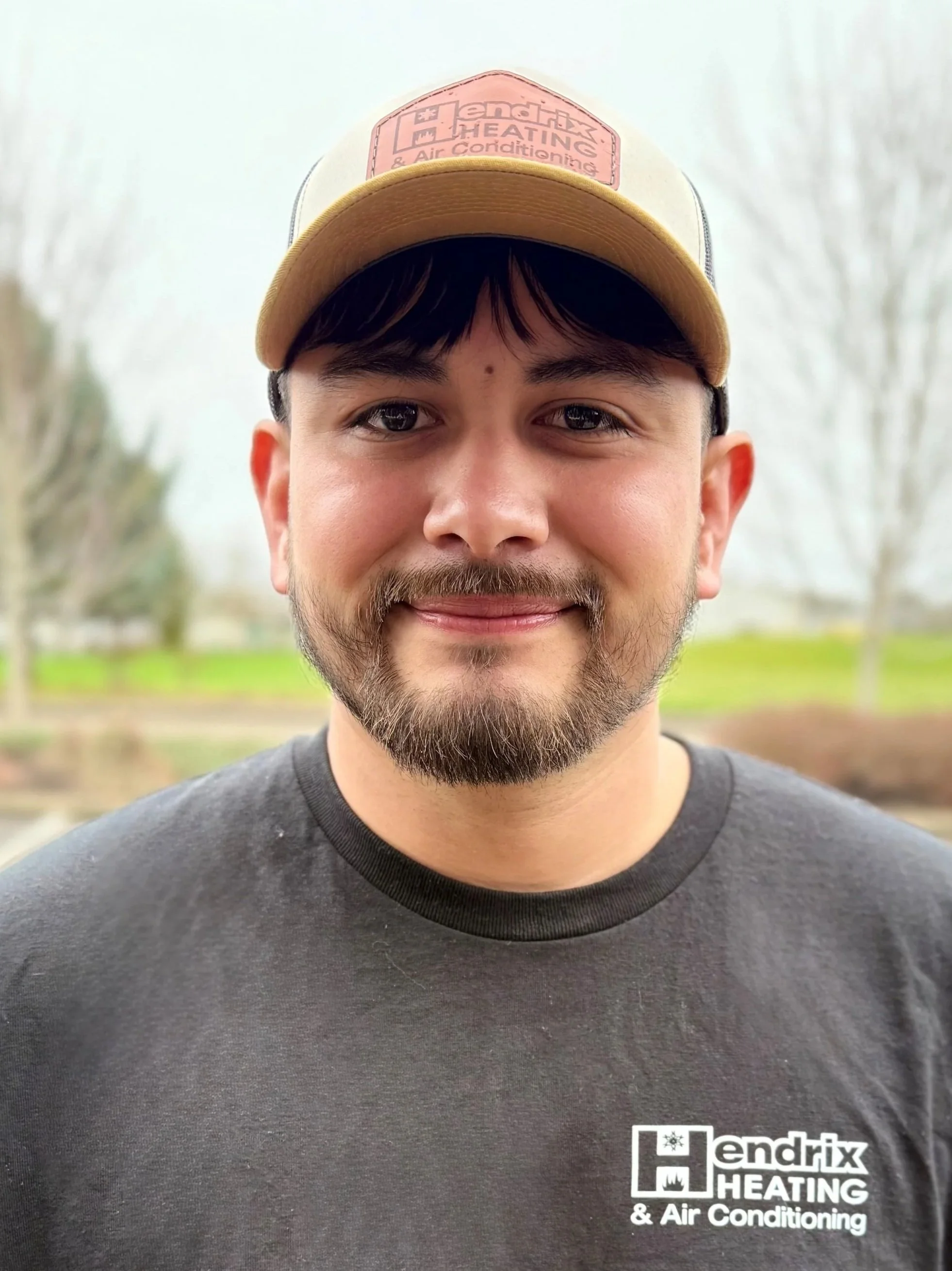 Man wearing hoodie and cap outdoors