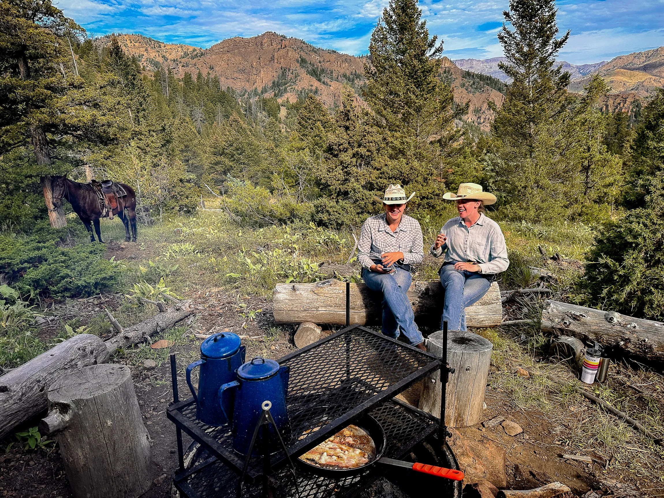 Two Wyoming dude ranch guests on a breakfast ride. 