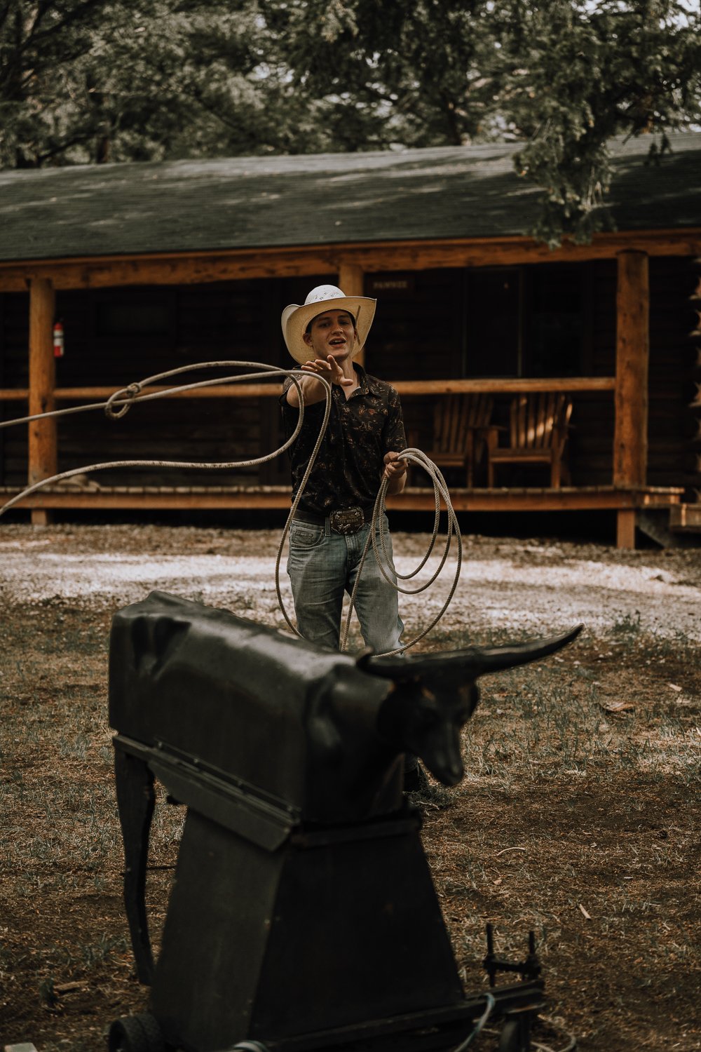 A dude ranch guest practices roping at Blackwater Creek Ranch.