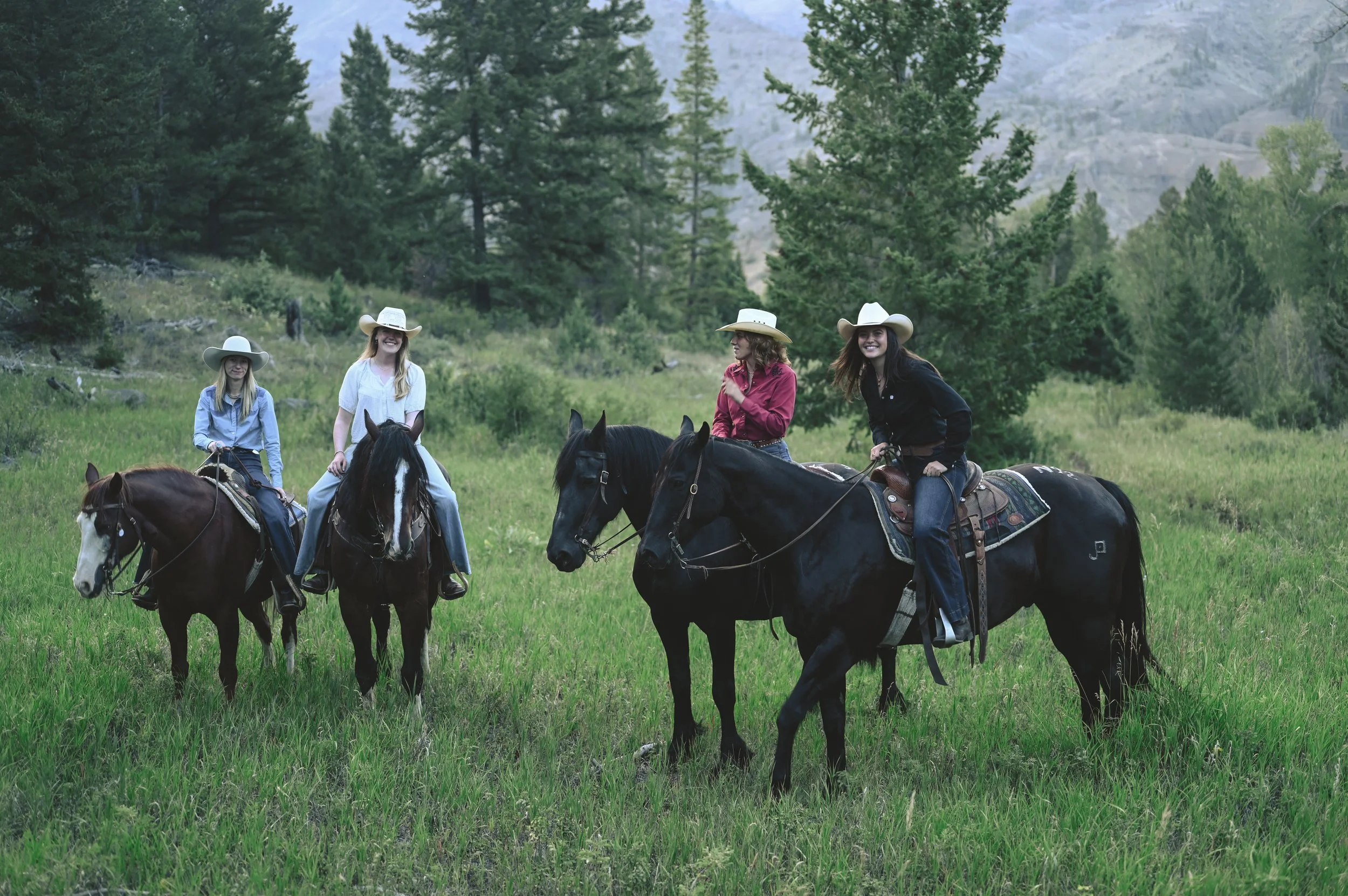 A group horseback riding vacation in Wyoming.