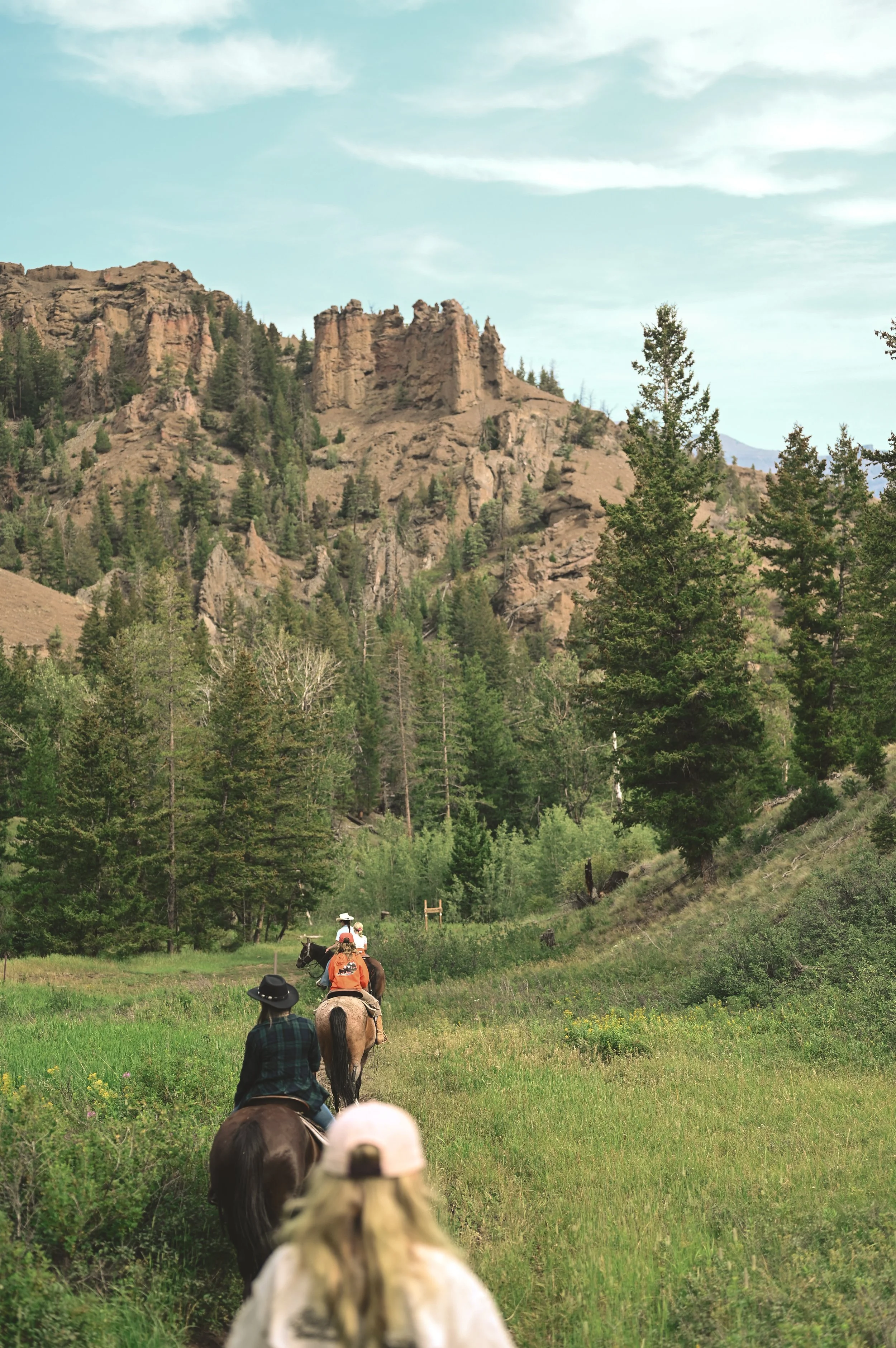Riding in the shadow of mountains in Wyoming.