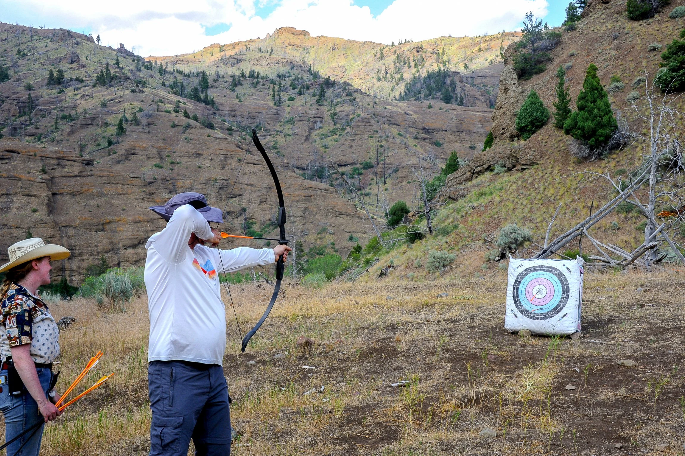 Aiming at a target during archery practice. 