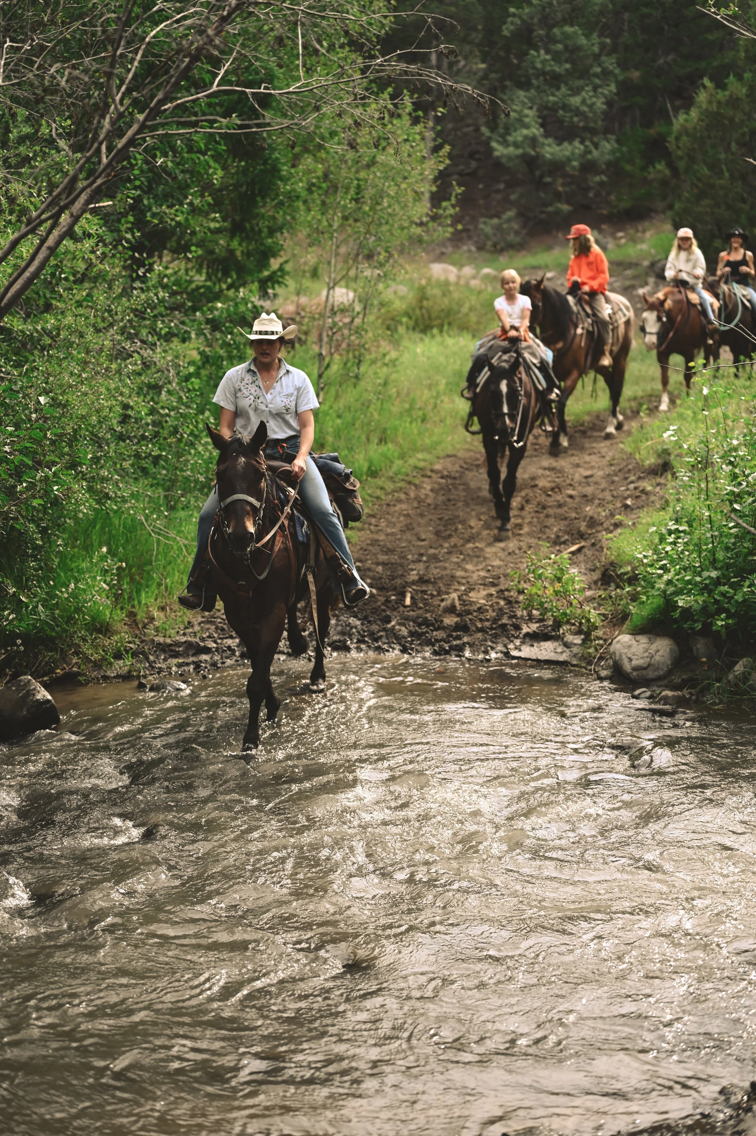 Crossing Blackwater Creek on horseback. 