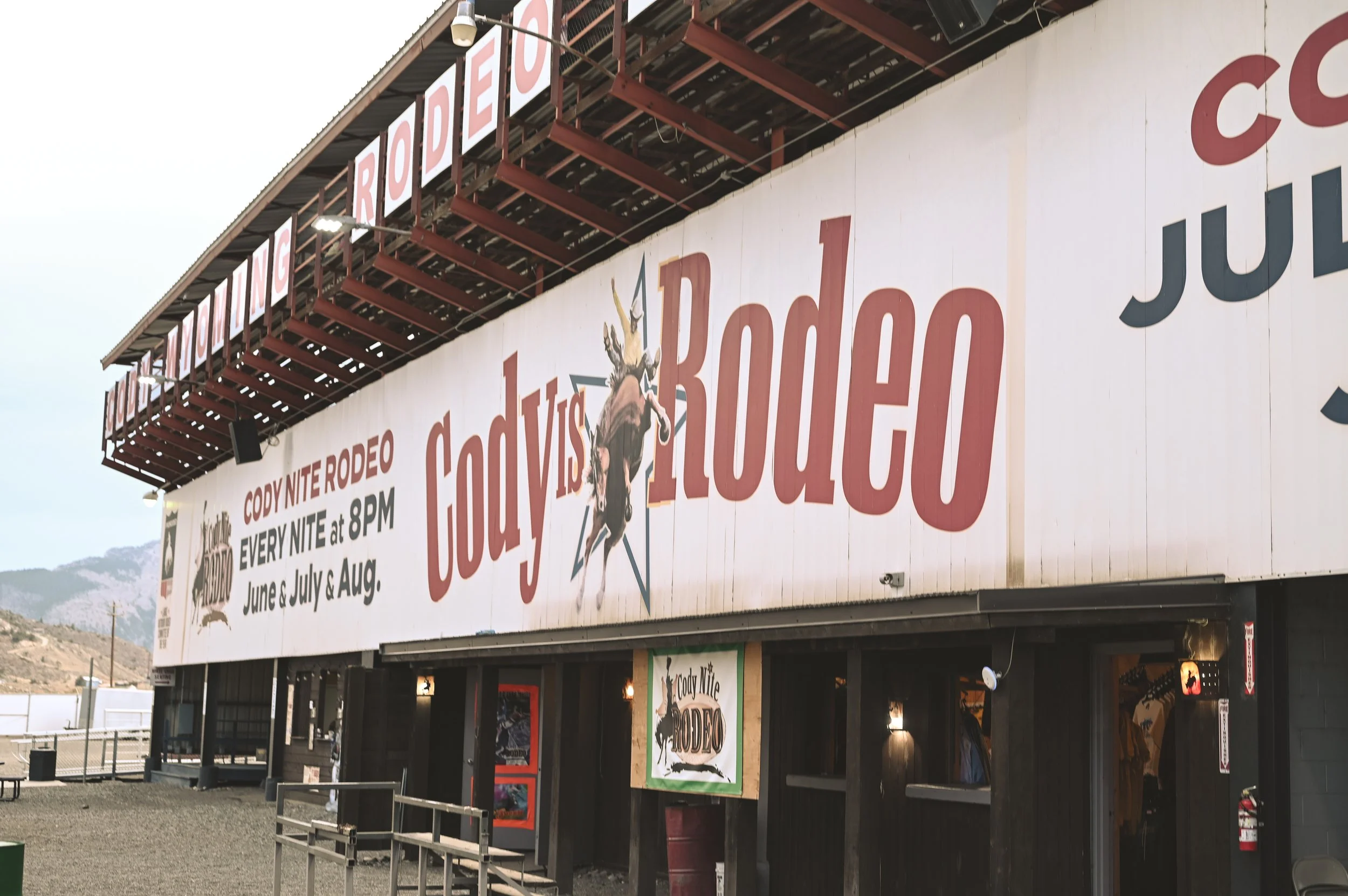 Visiting the Cody Nite Rodeo during a dude ranch vacation.