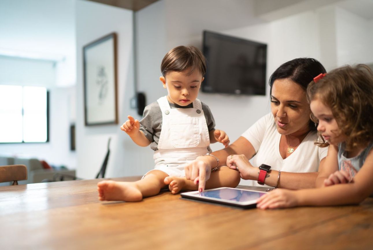 A family looking at a tablet
