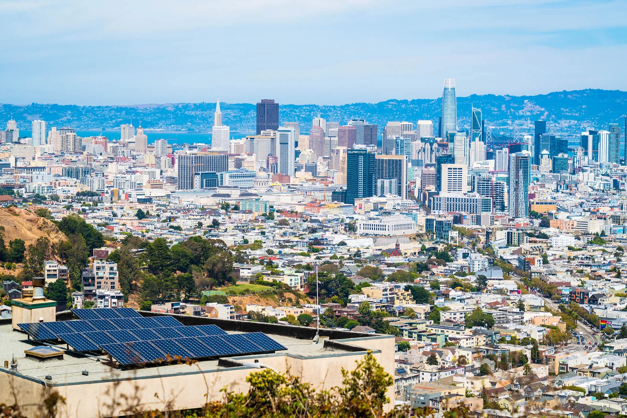 Aerial view of a rooftop that has solar panels.