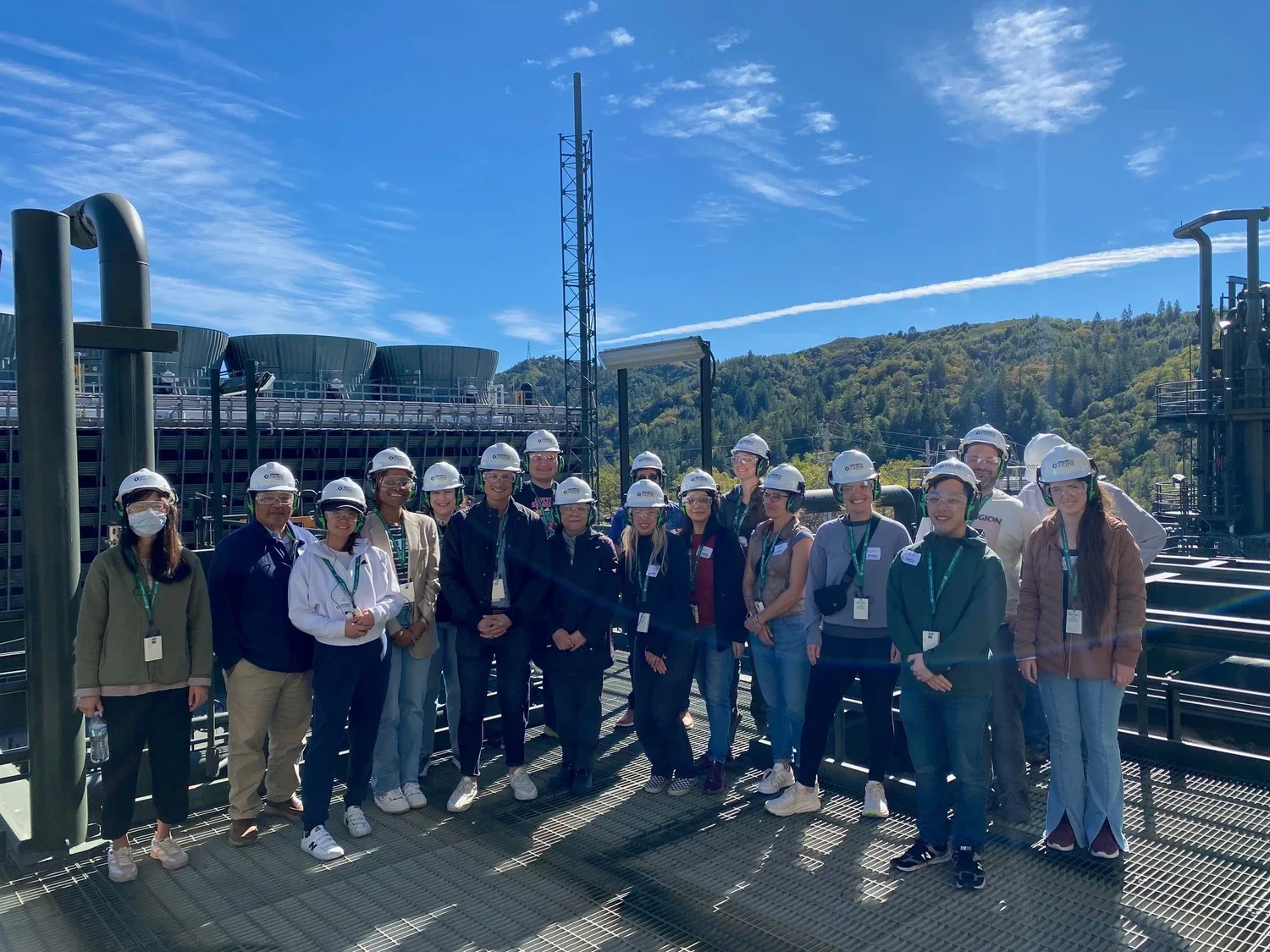 The tour group wearing hard hats.