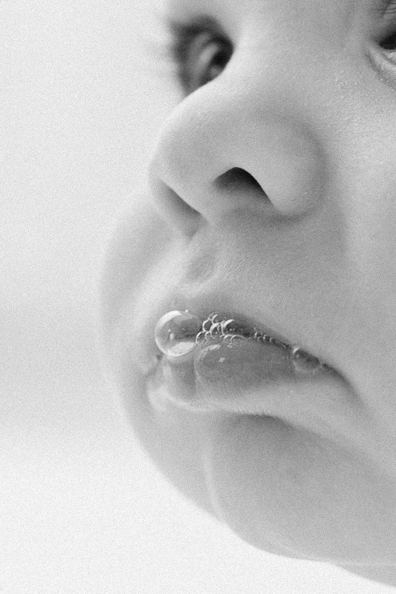 baby photographer in the woodlands, tx captures spit bubbles for photoshoot