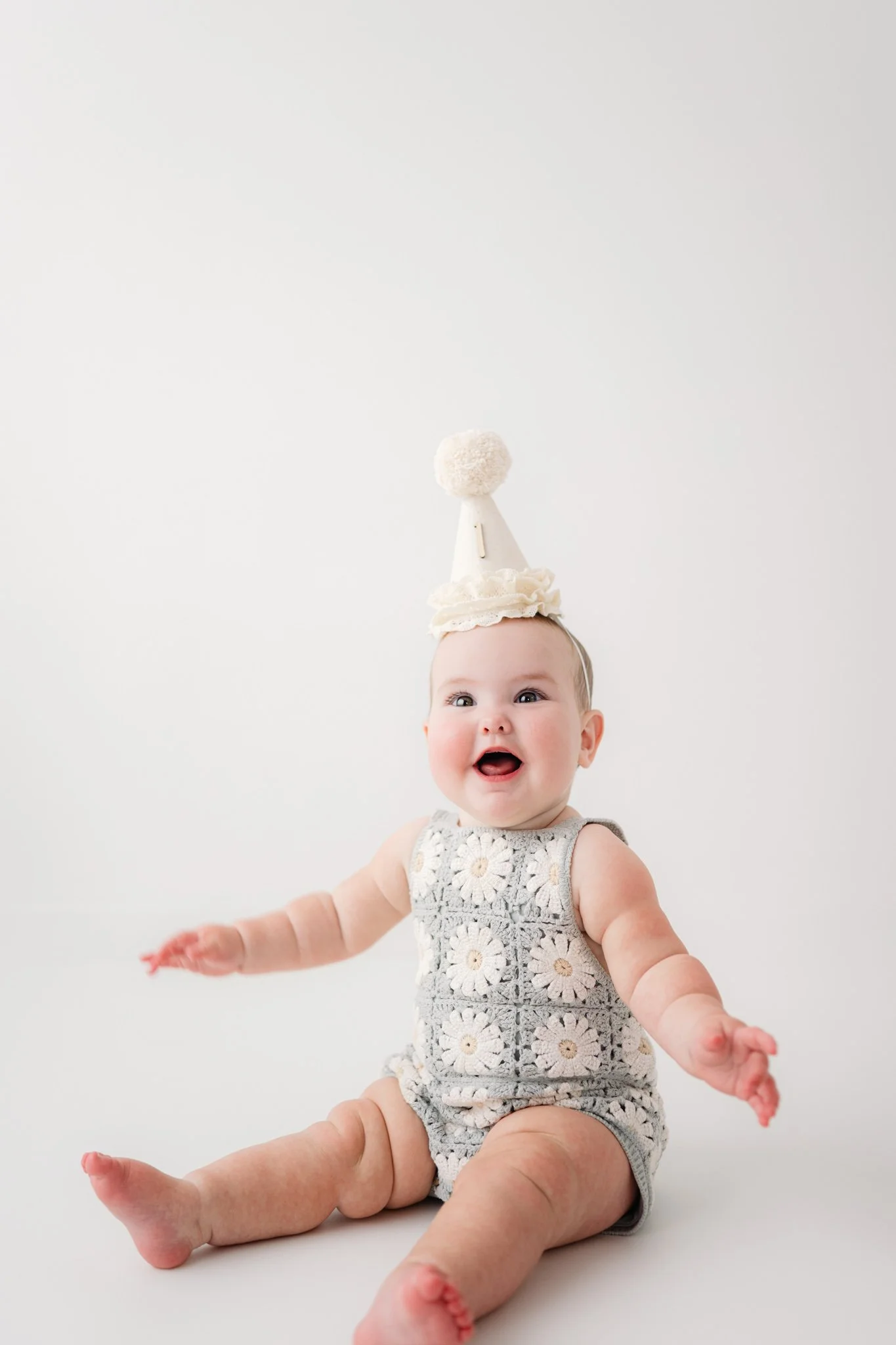 first birthday photoshoot with party hat and cake in the woodlands, texas