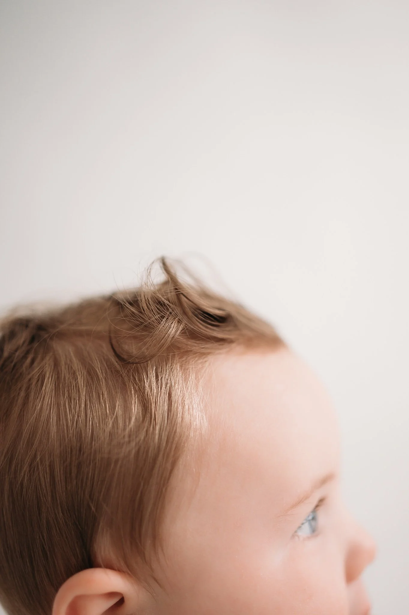 close up detail of baby hair during milestone session Studio Brae Houston TX