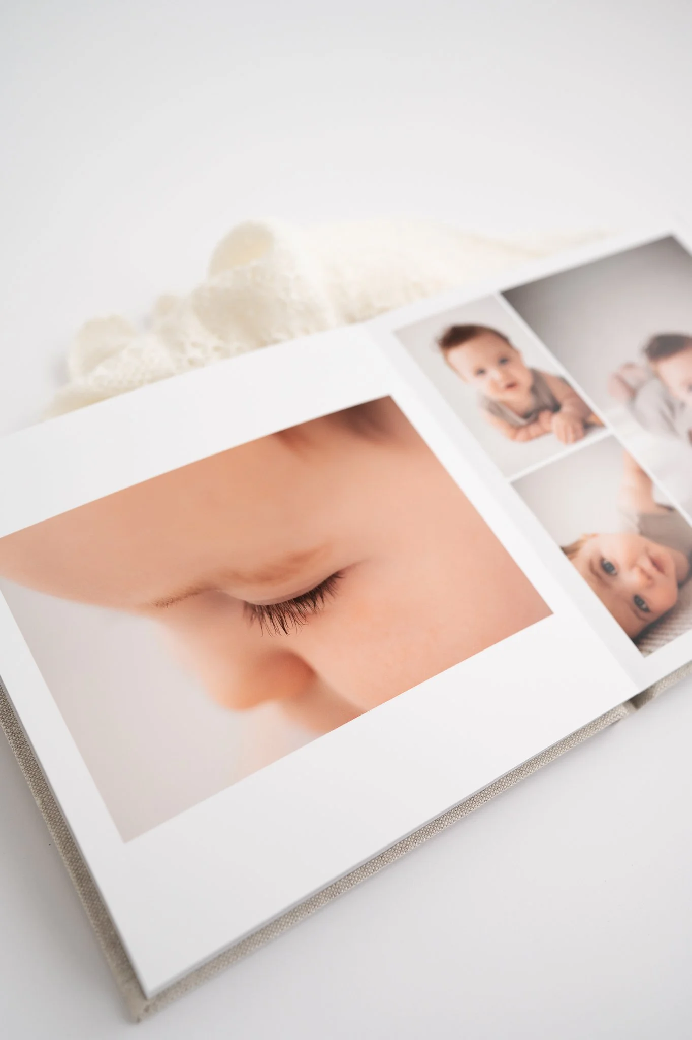 Heirloom family photo album featuring timeless newborn and motherhood portraits