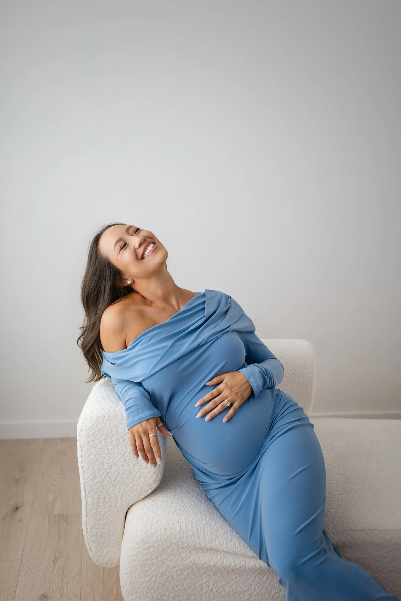 Pregnant mother wearing a blue gown during an elegant Houston maternity photography session