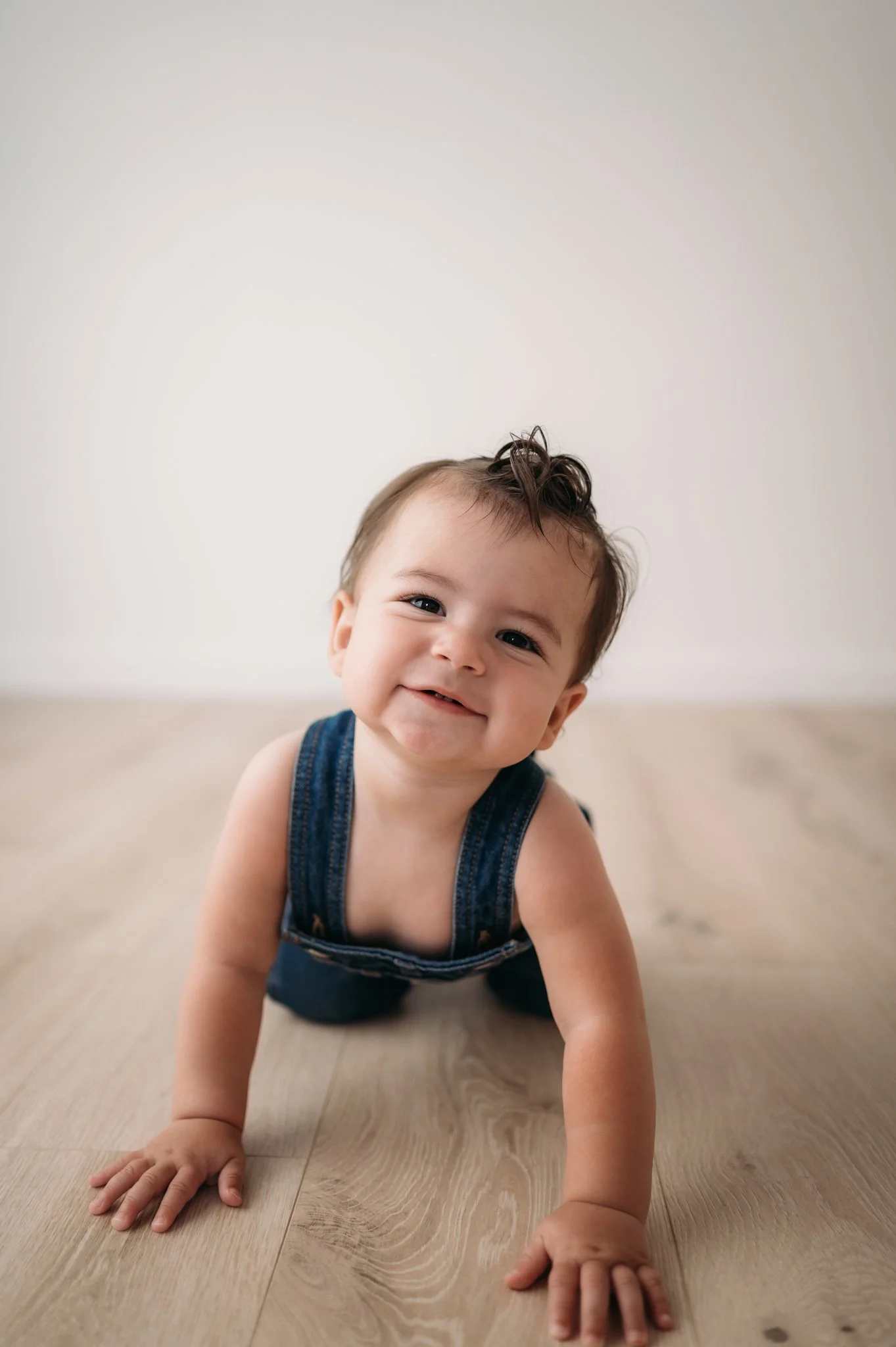 baby boy crawling and smiling during sitter milestone session The Woodlands TX