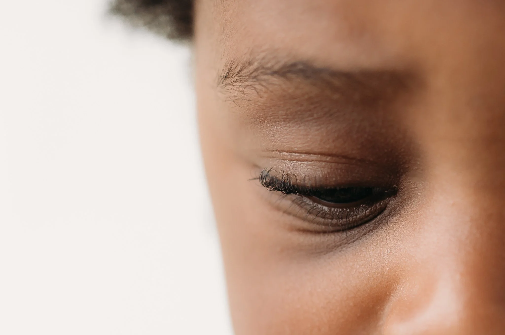 close up detail of baby eyelashes during milestone session The Woodlands TX