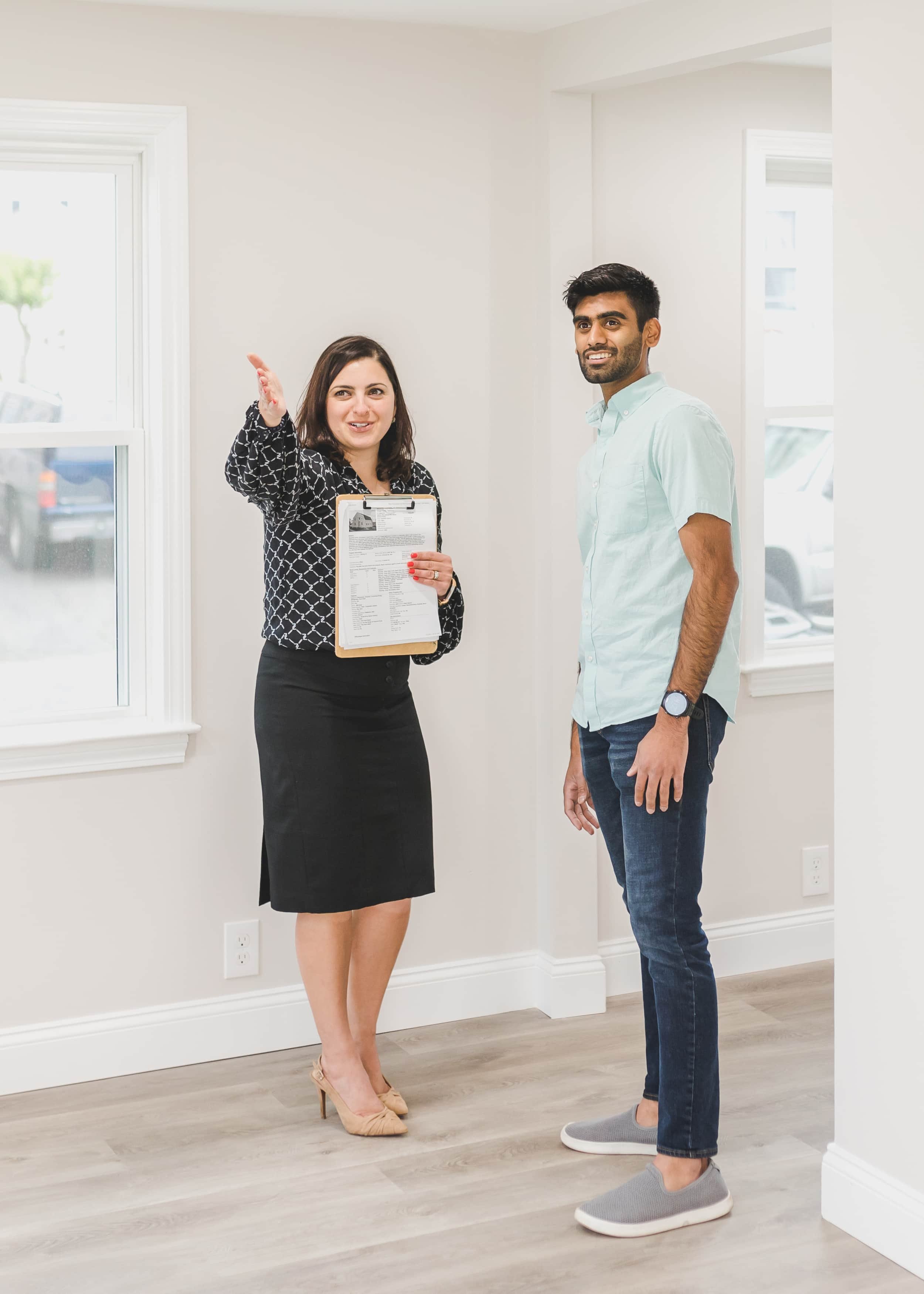 Agent with client touring a home