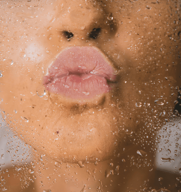 woman kissing wet glass for marketing agency for med spas