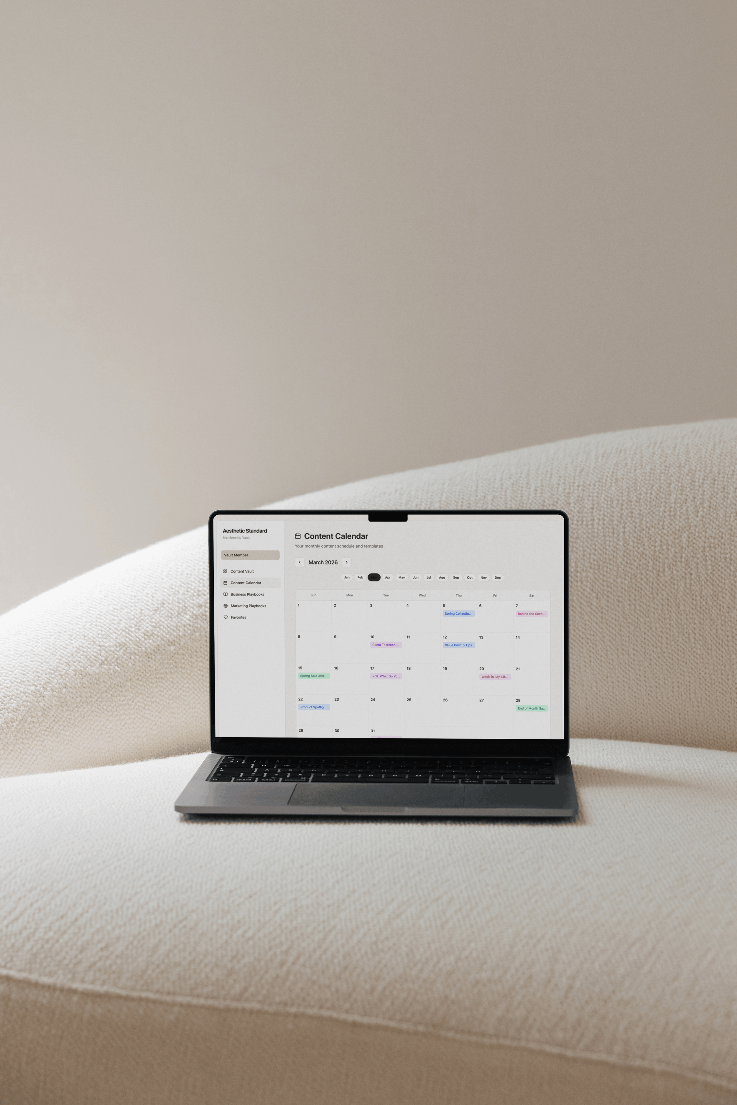 a laptop on a couch showing a marketing calendar for med spas 