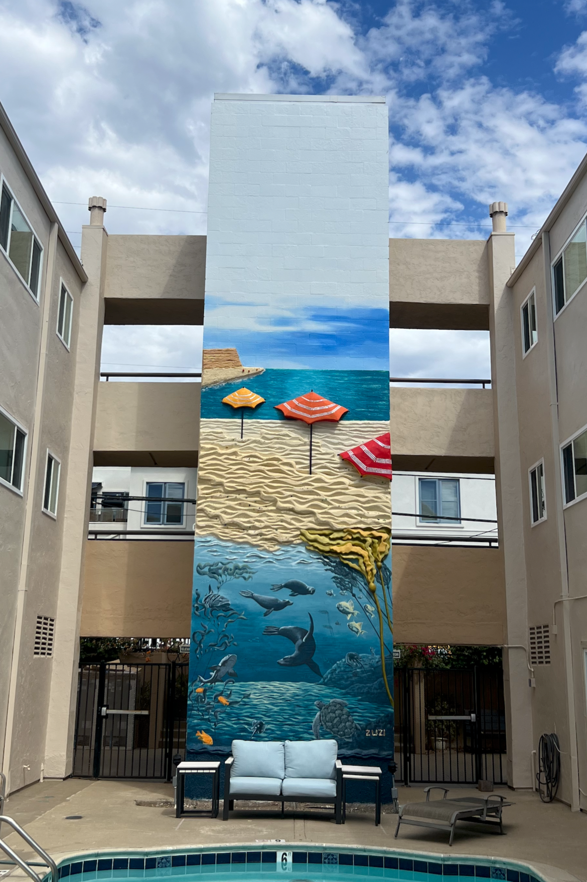 Teeming with Life, a 34-foot ocean mural with 3D relief sand and sea life, Casa Linda Apartments courtyard, La Jolla