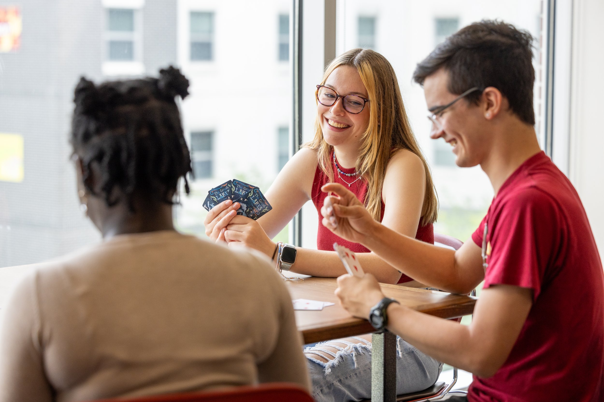 Geoffroy Residence Hall Den Students Playing Game 7-23-24 2.jpg