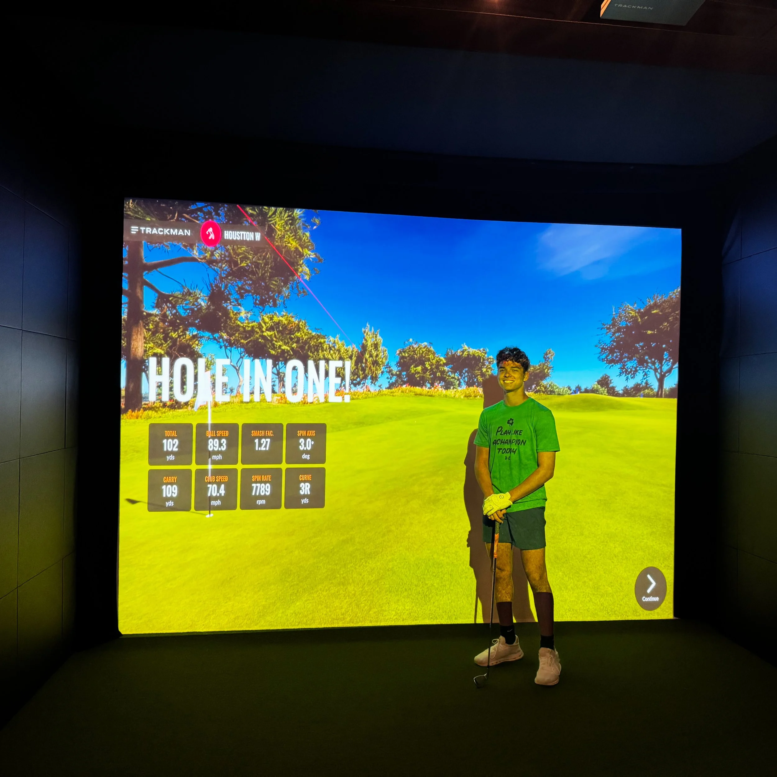 Houstton celebrating the first and only hole-in-one on a TrackMan golf simulator at Broligans indoor golf.