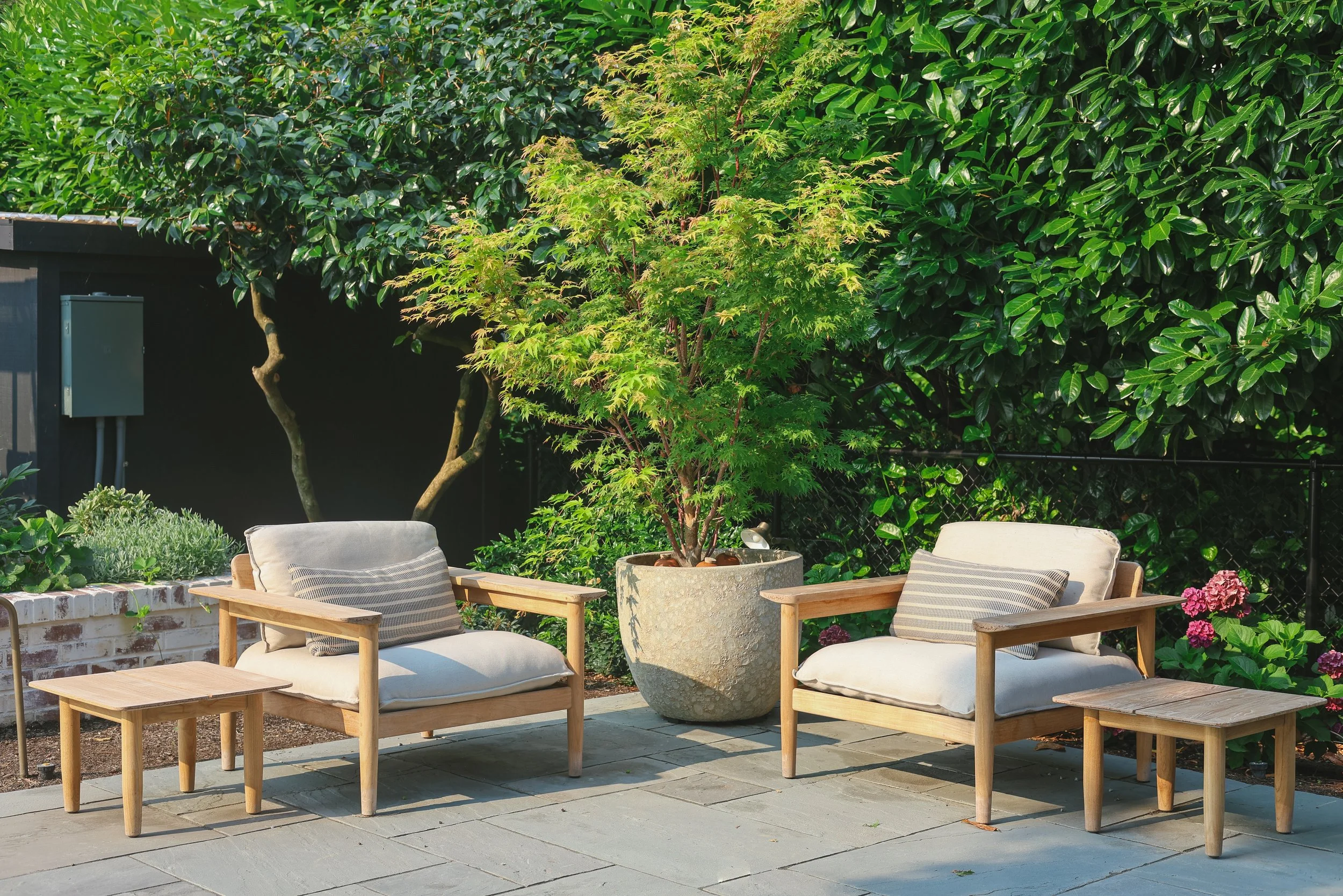 With new plantings and patio furniture the space now invites you to come out and enjoy.