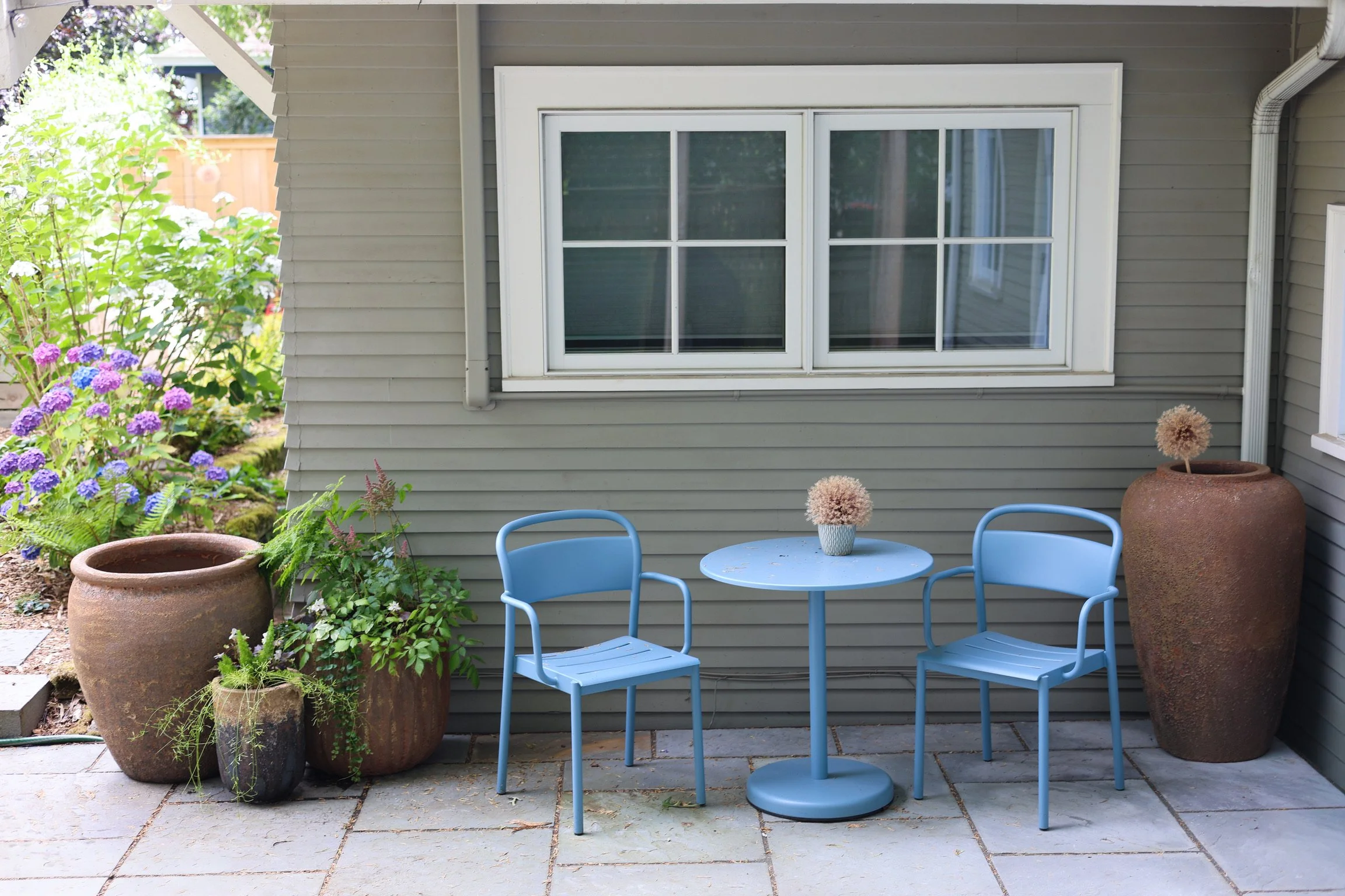 A now expanded patio allows for multiple seating areas.