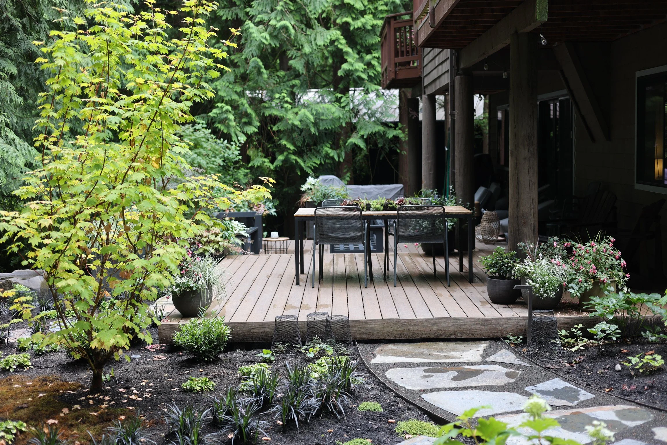The new floating deck flows with the landscape and creates new spaces to dine and relax.