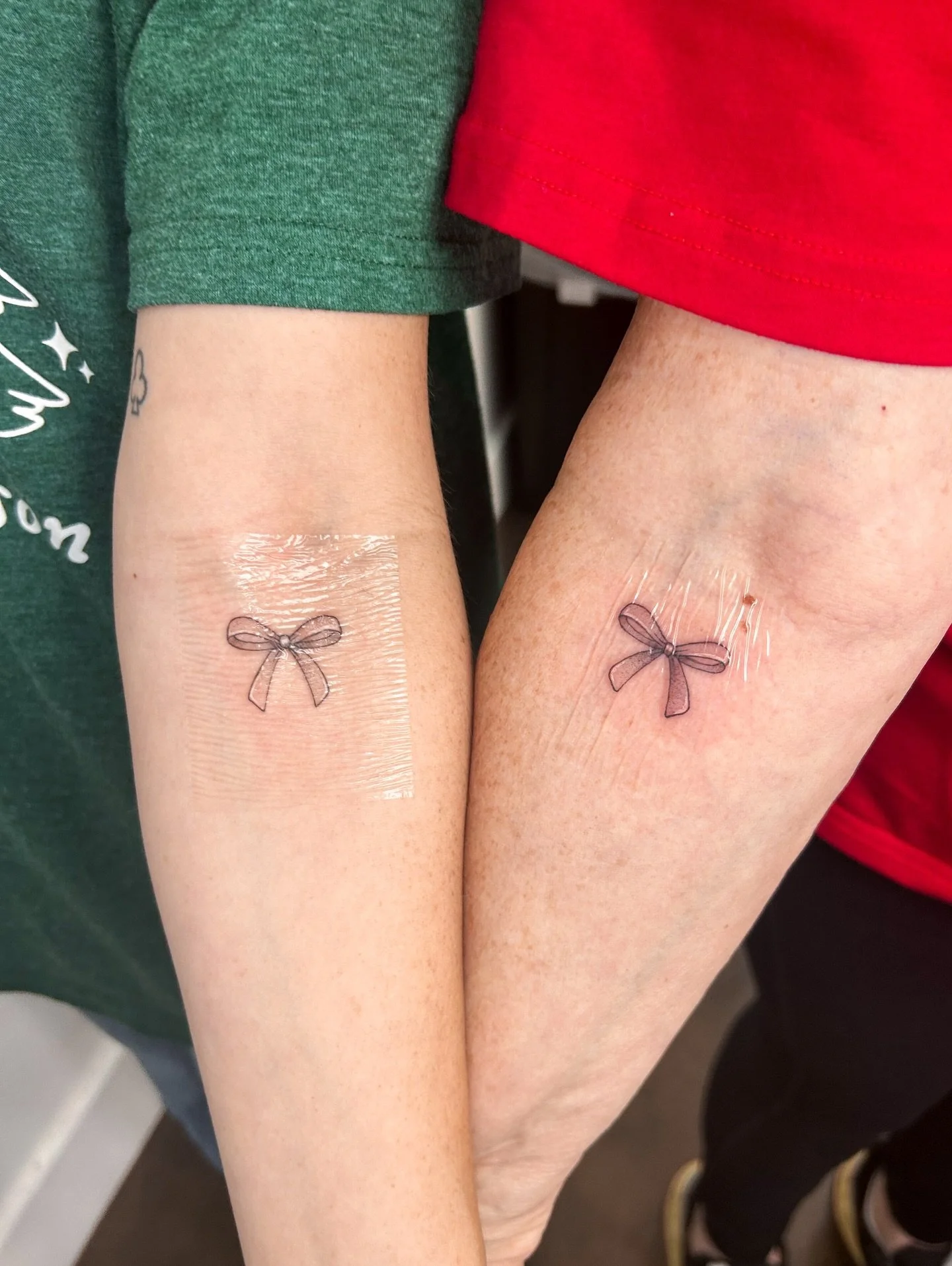 Matching tattoos for a mother/daughter duo. This is the mother&rsquo;s first tattoo ever and was also her Christmas gift from her daughter! (Peep the Christmas colored shirts hehe) 🎀

Currently booking through April 🗓️
Located in Orange County, CA 
