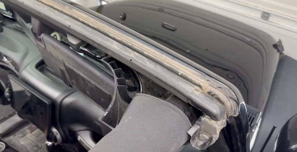 Dirty, dry and contaminated Jeep Wrangler header seal before cleaning and conditioning